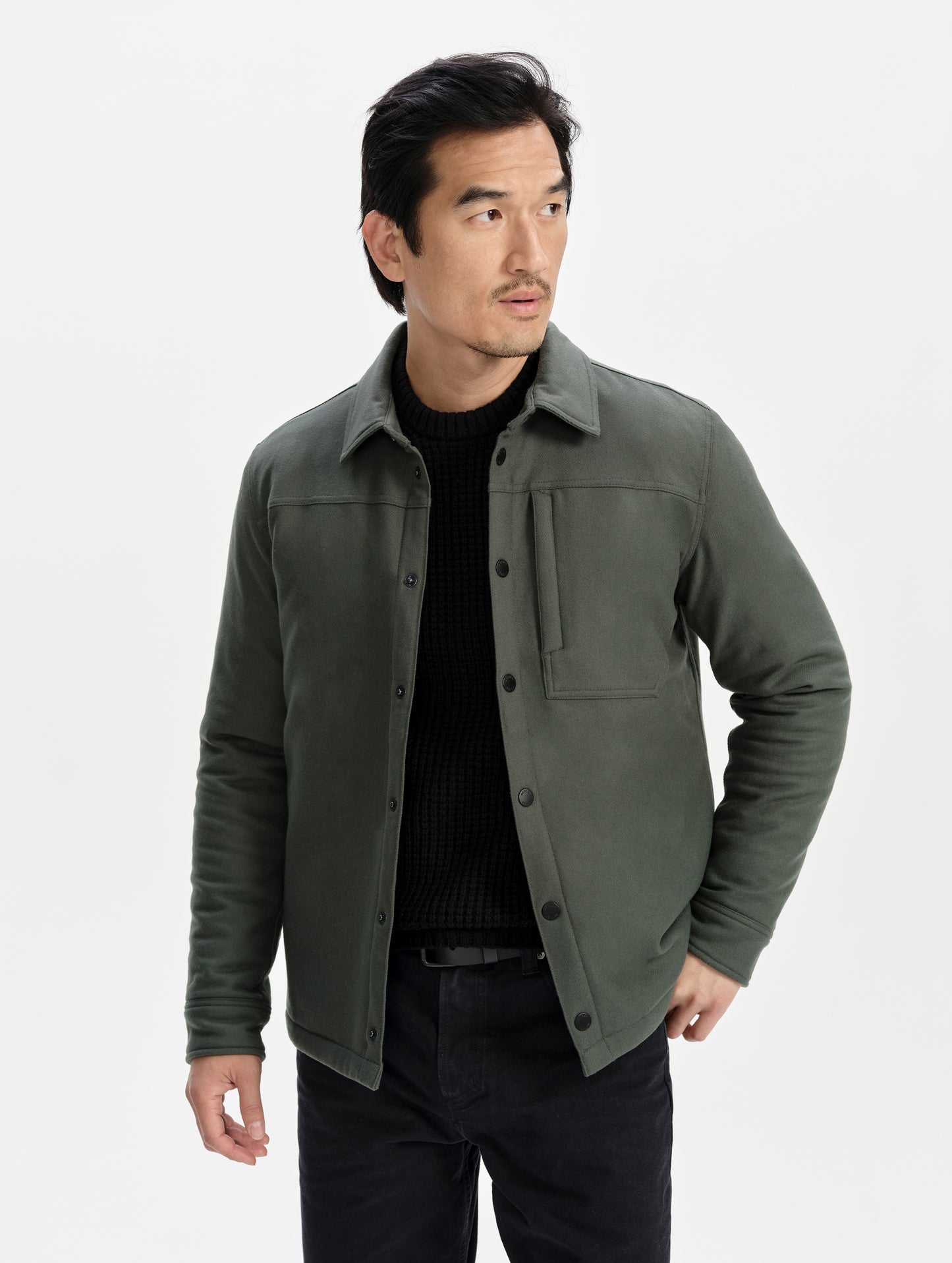 Front upper-body view of man wearing the Nova Insulated Button-Down in Saville Green from AETHER Apparel.