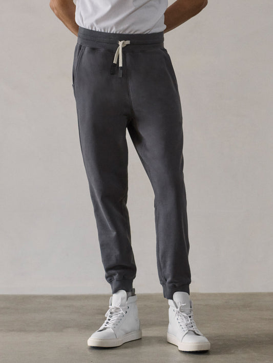 Front lower-body view of man wearing Osa Cuffed Sweatpant in Graphite grey from AETHER Apparel.