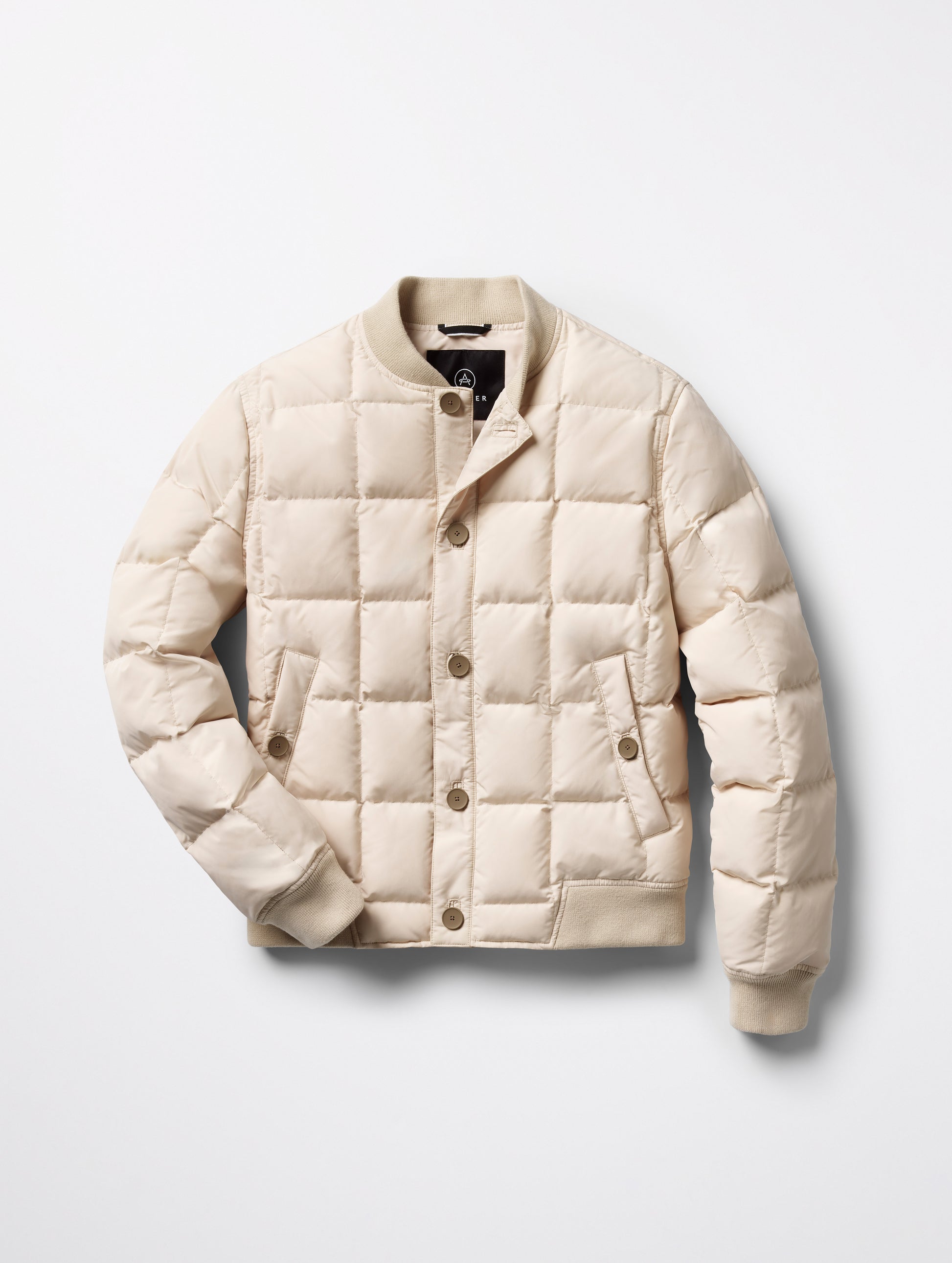 Flat lay of Pacer Jacket in Bone white from AETHER Apparel.