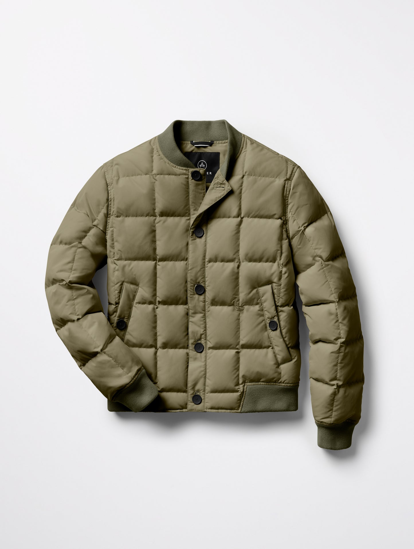 Flat lay of Pacer Jacket in Fern Green from AETHER Apparel.