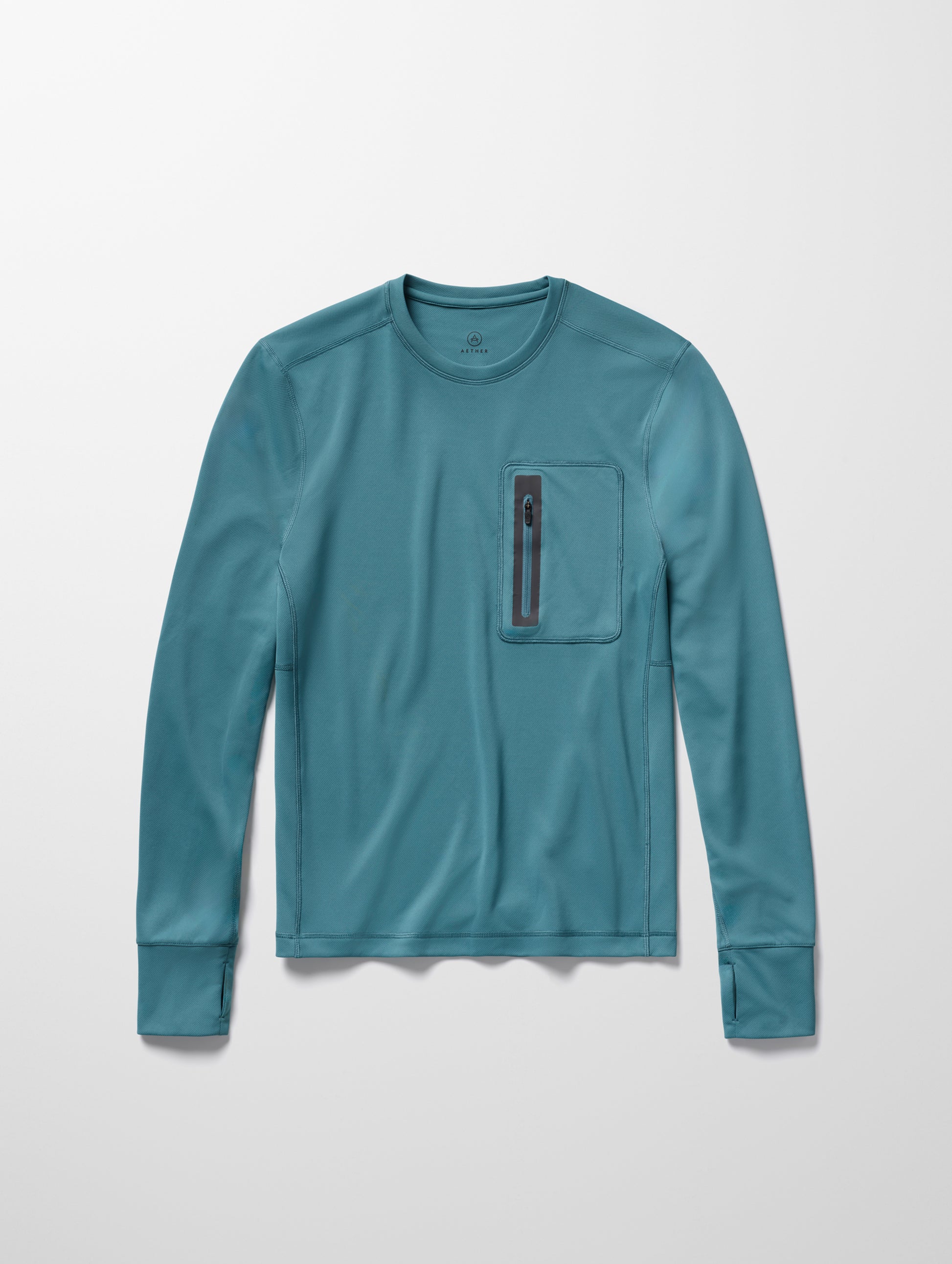 Flay lay image of men’s Pacific Crewneck Sun Shirt in Aqua Blue from AETHER Apparel.