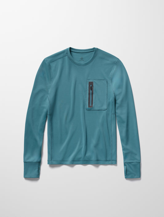 Flay lay image of men’s Pacific Crewneck Sun Shirt in Aqua Blue from AETHER Apparel.