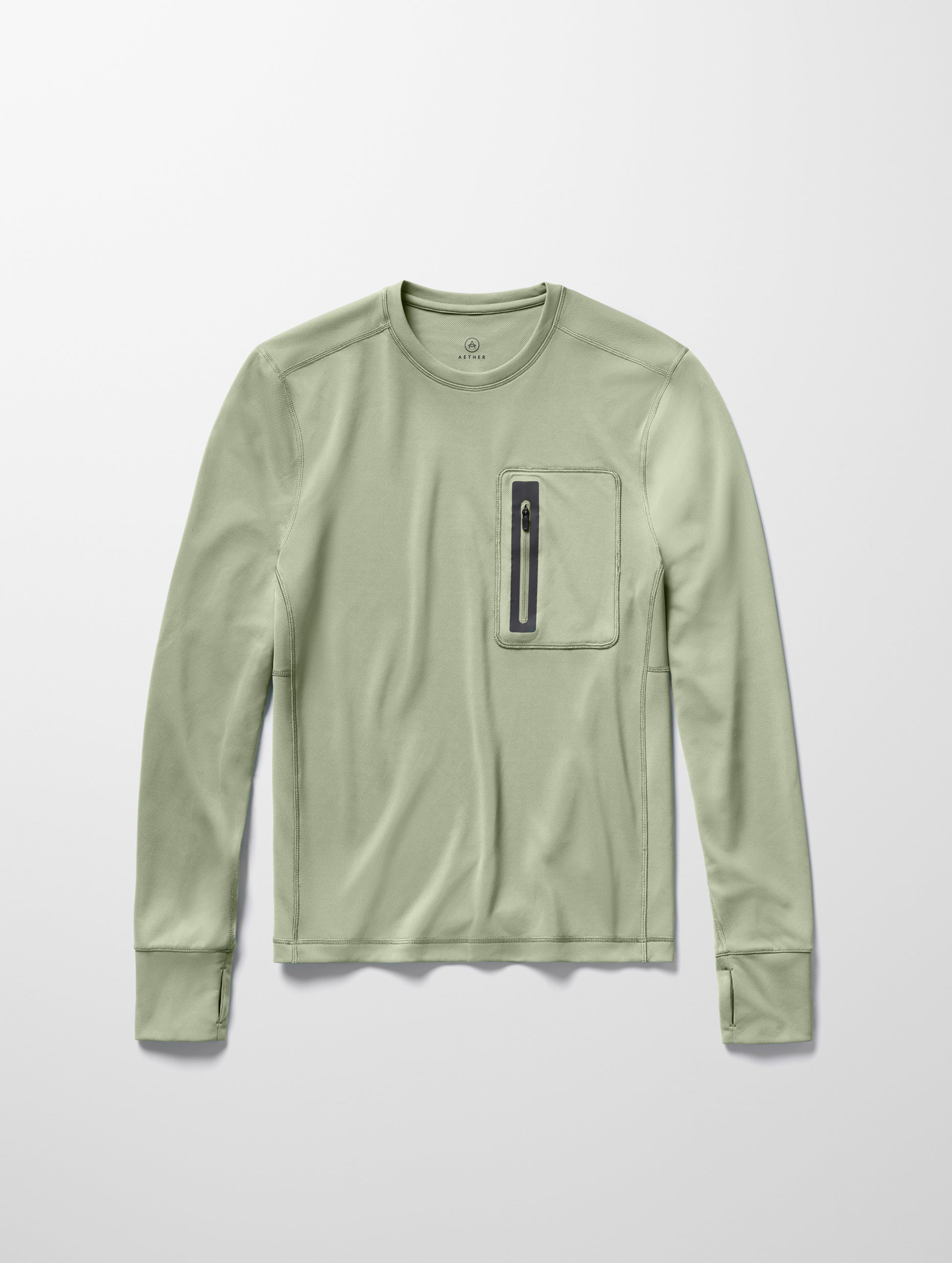Flay lay image of men’s Pacific Crewneck Sun Shirt in Sage Green from AETHER Apparel.