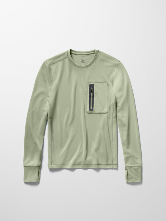 Flay lay image of men’s Pacific Crewneck Sun Shirt in Sage Green from AETHER Apparel.
