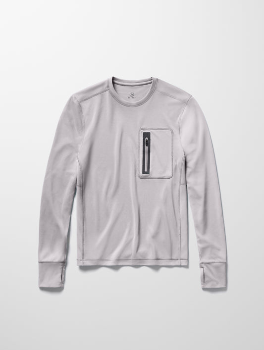 Flay lay image of men’s Pacific Crewneck Sun Shirt in Sky Grey from AETHER Apparel.