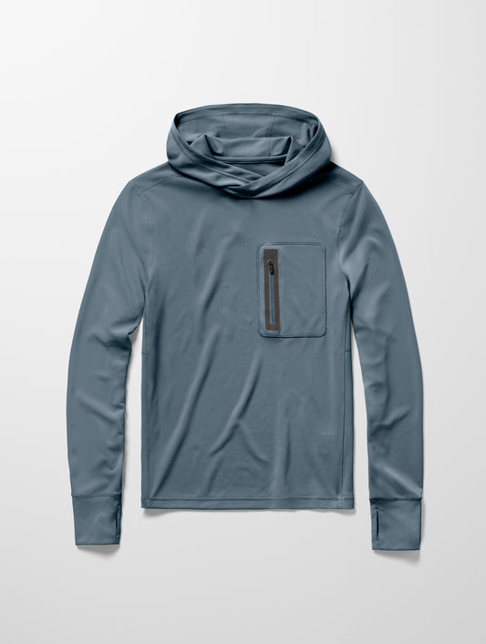 Flay lay image of men’s Pacific Hooded Sun Shirt in Portal Blue from AETHER Apparel.