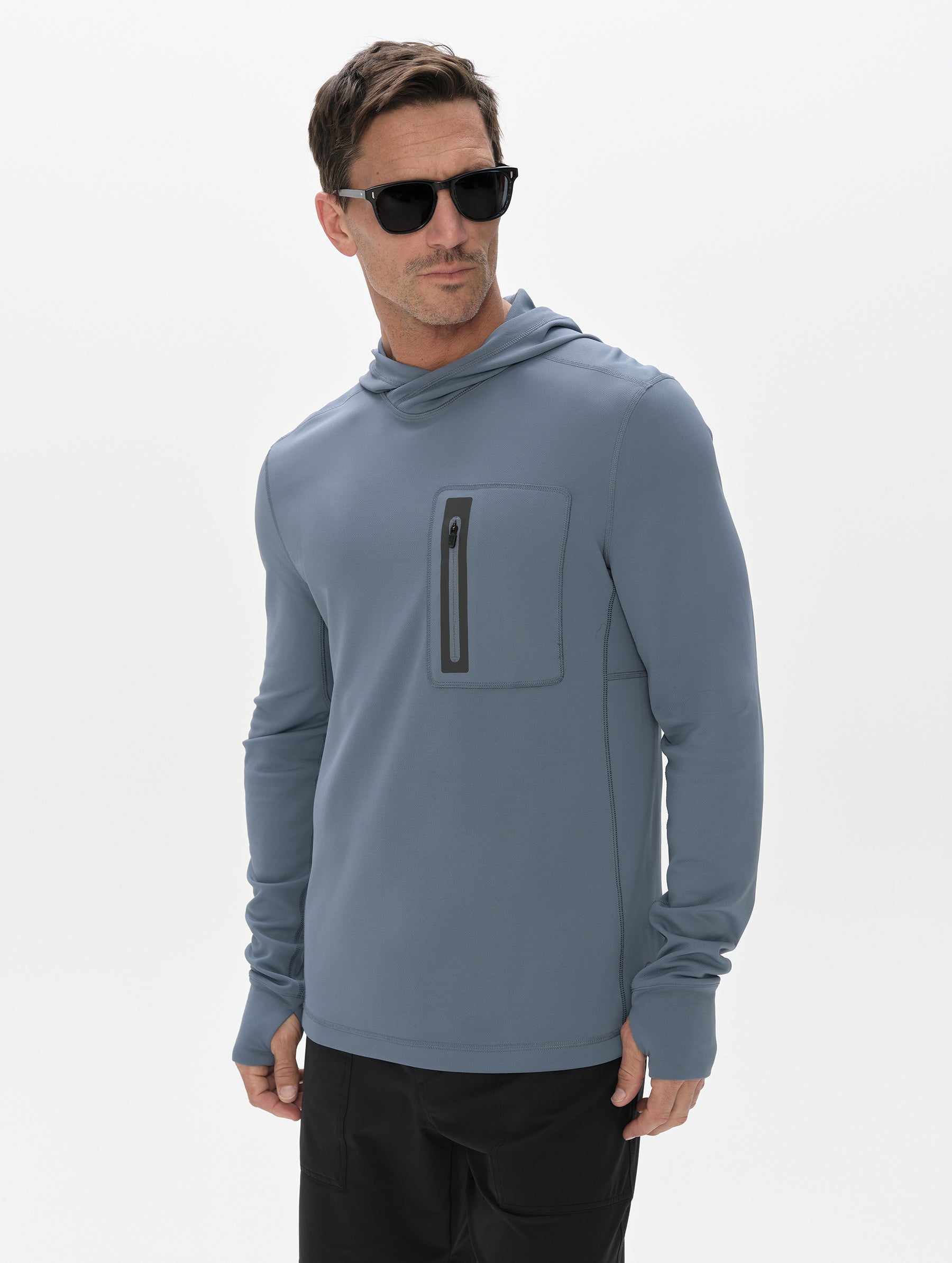 Front upper-body view of man wearing Pacific Hooded Sun Shirt in Portal Blue from AETHER Apparel.