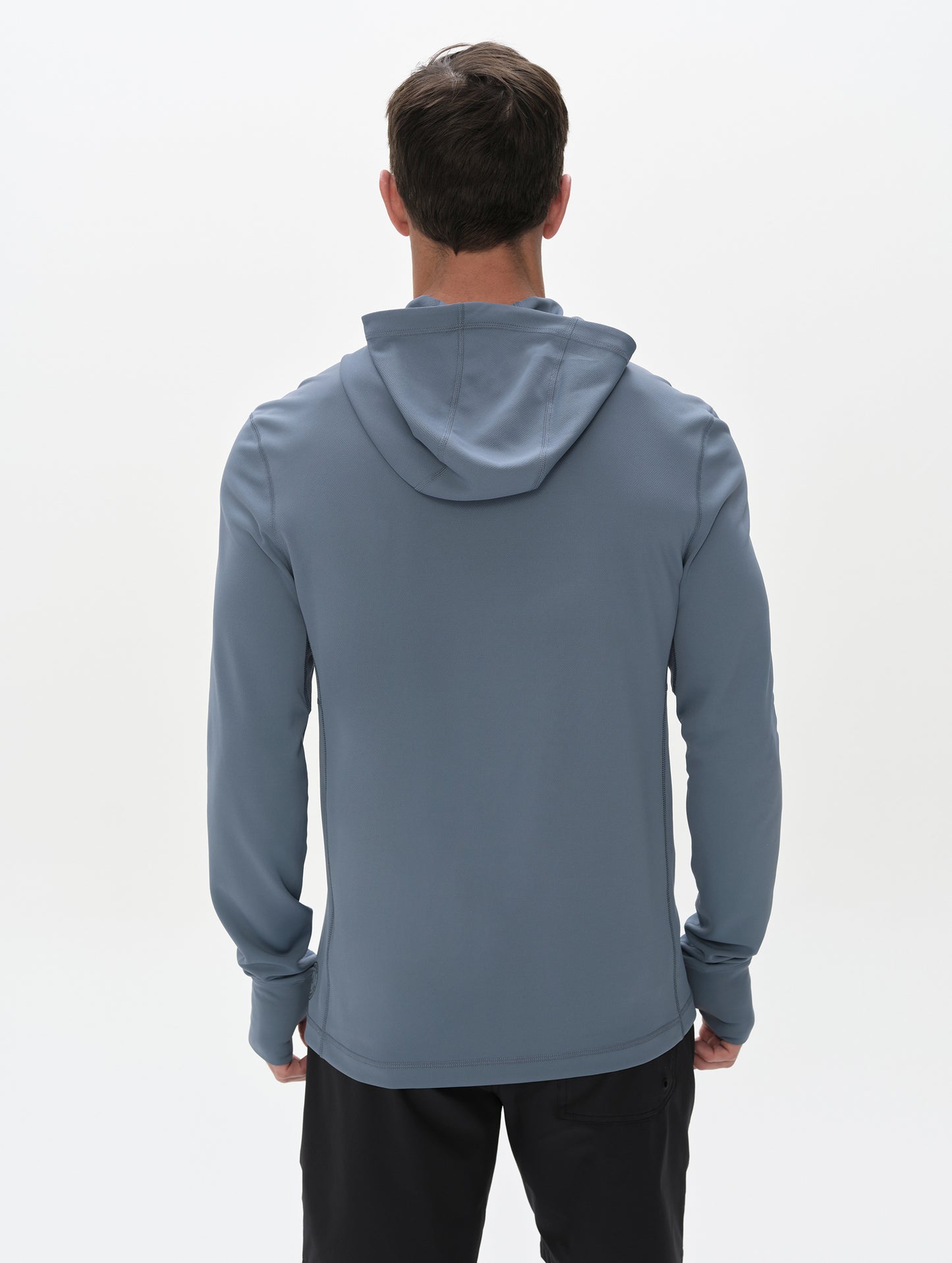 Rear upper-body view of man wearing Pacific Hooded Sun Shirt in Portal Blue from AETHER Apparel.