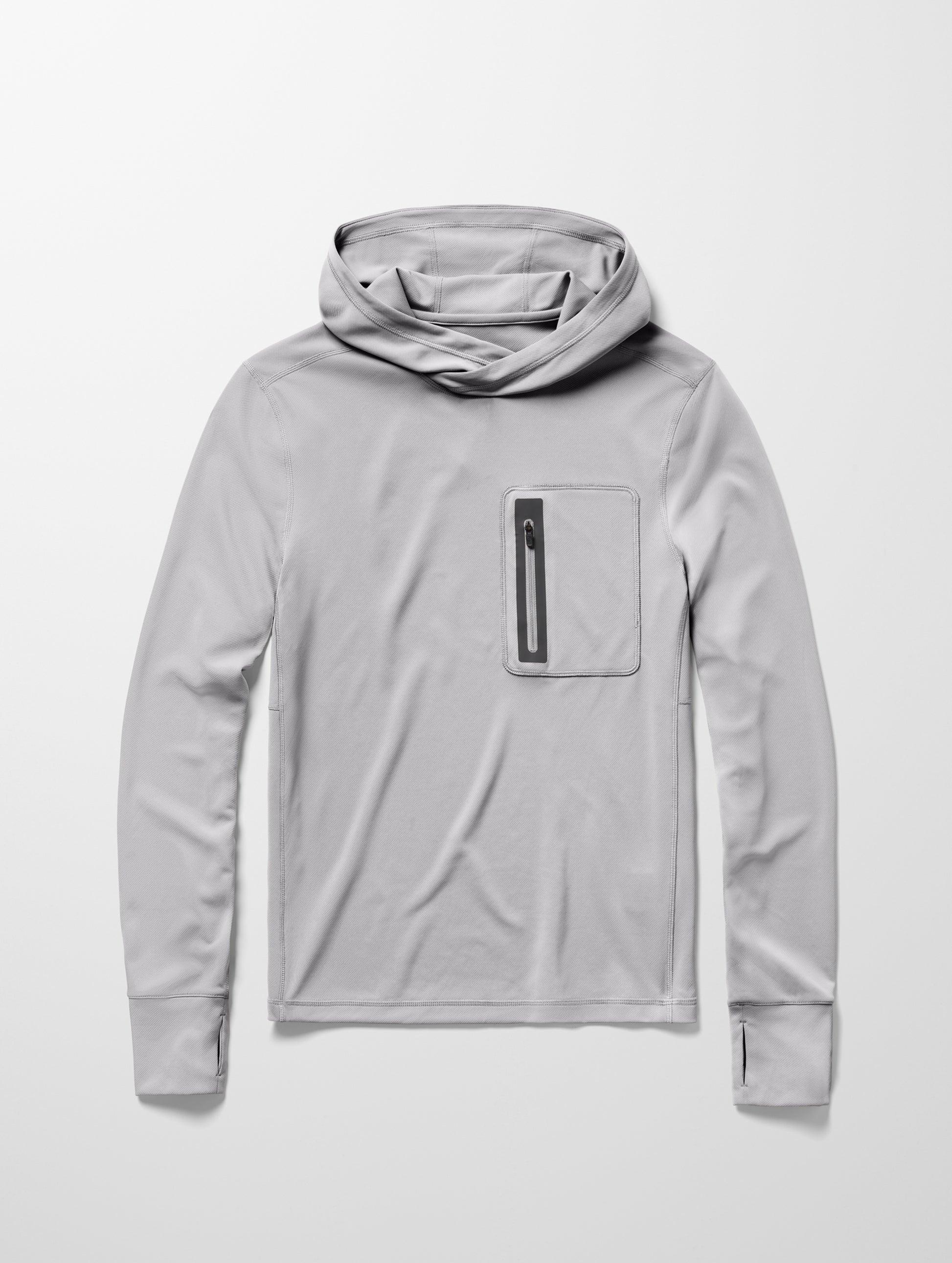 Flay lay image of men’s Pacific Hooded Sun Shirt in Sky Grey from AETHER Apparel.