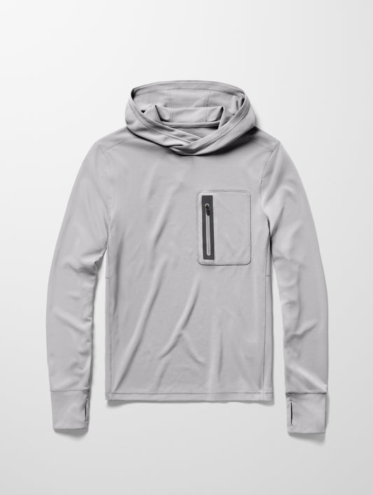 Flay lay image of men’s Pacific Hooded Sun Shirt in Sky Grey from AETHER Apparel.
