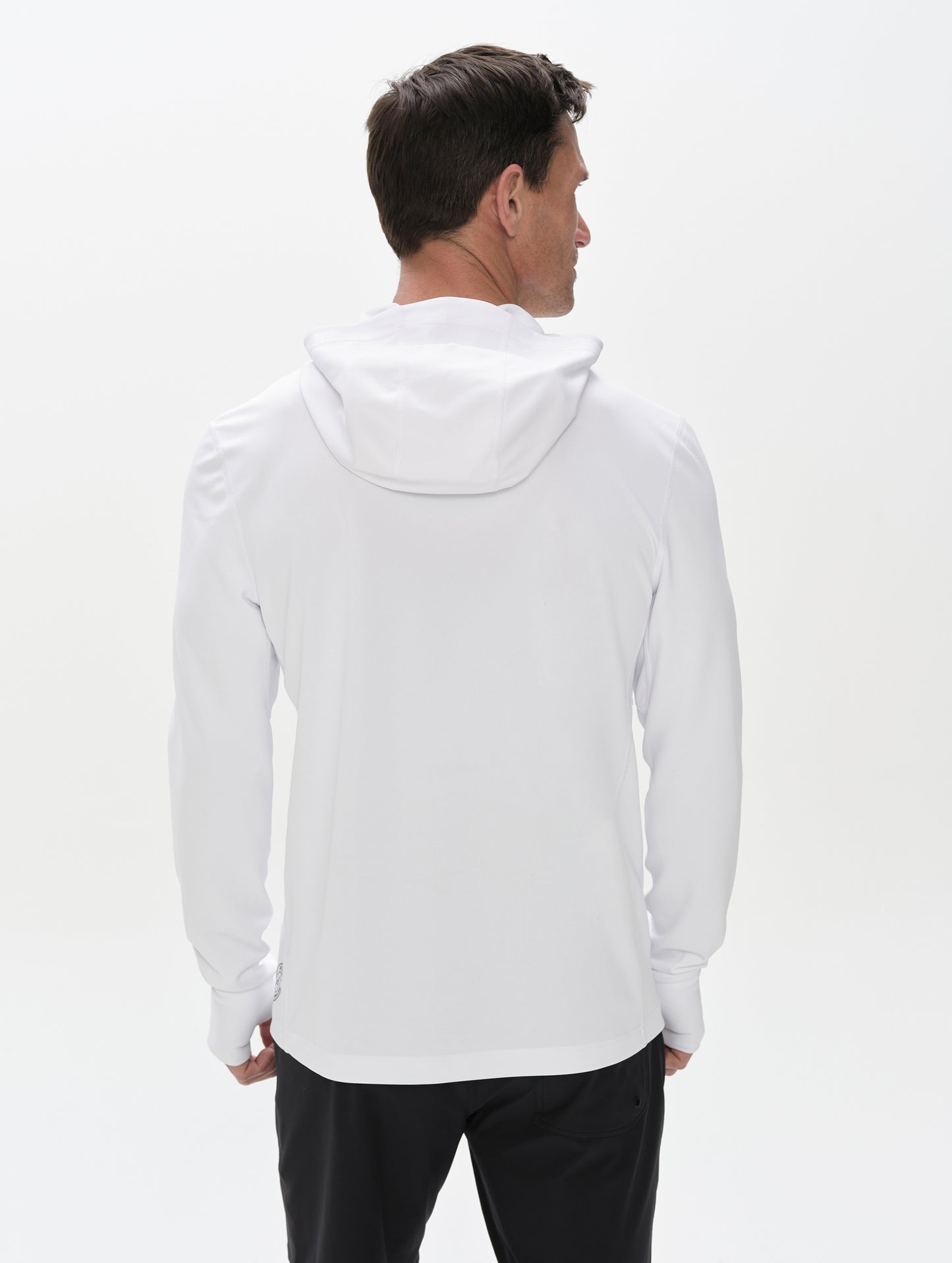 Rear upper-body view of man wearing Pacific Hooded Sun Shirt in White from AETHER Apparel.
