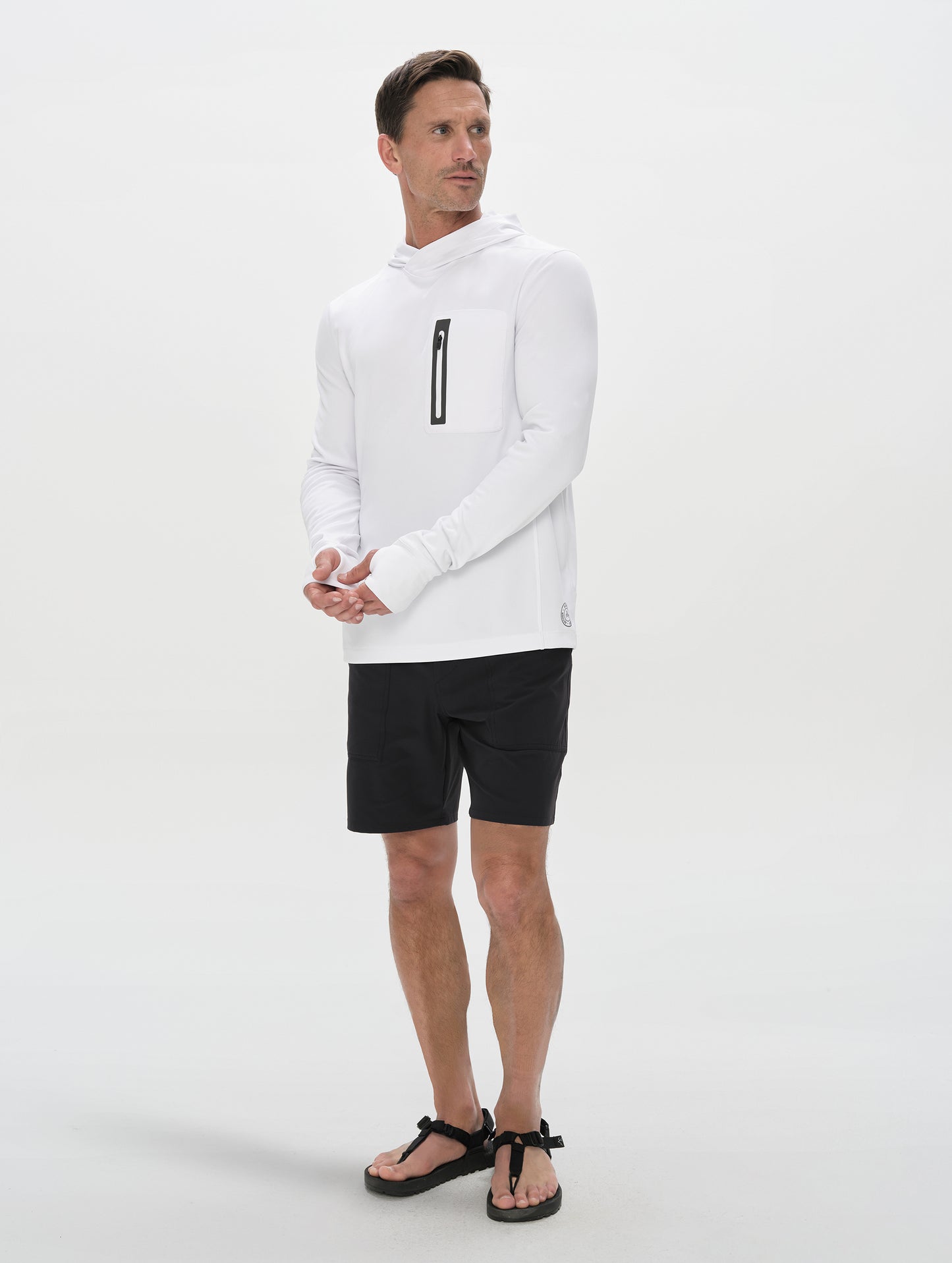 Front full-body view of man wearing Pacific Hooded Sun Shirt in White from AETHER Apparel.