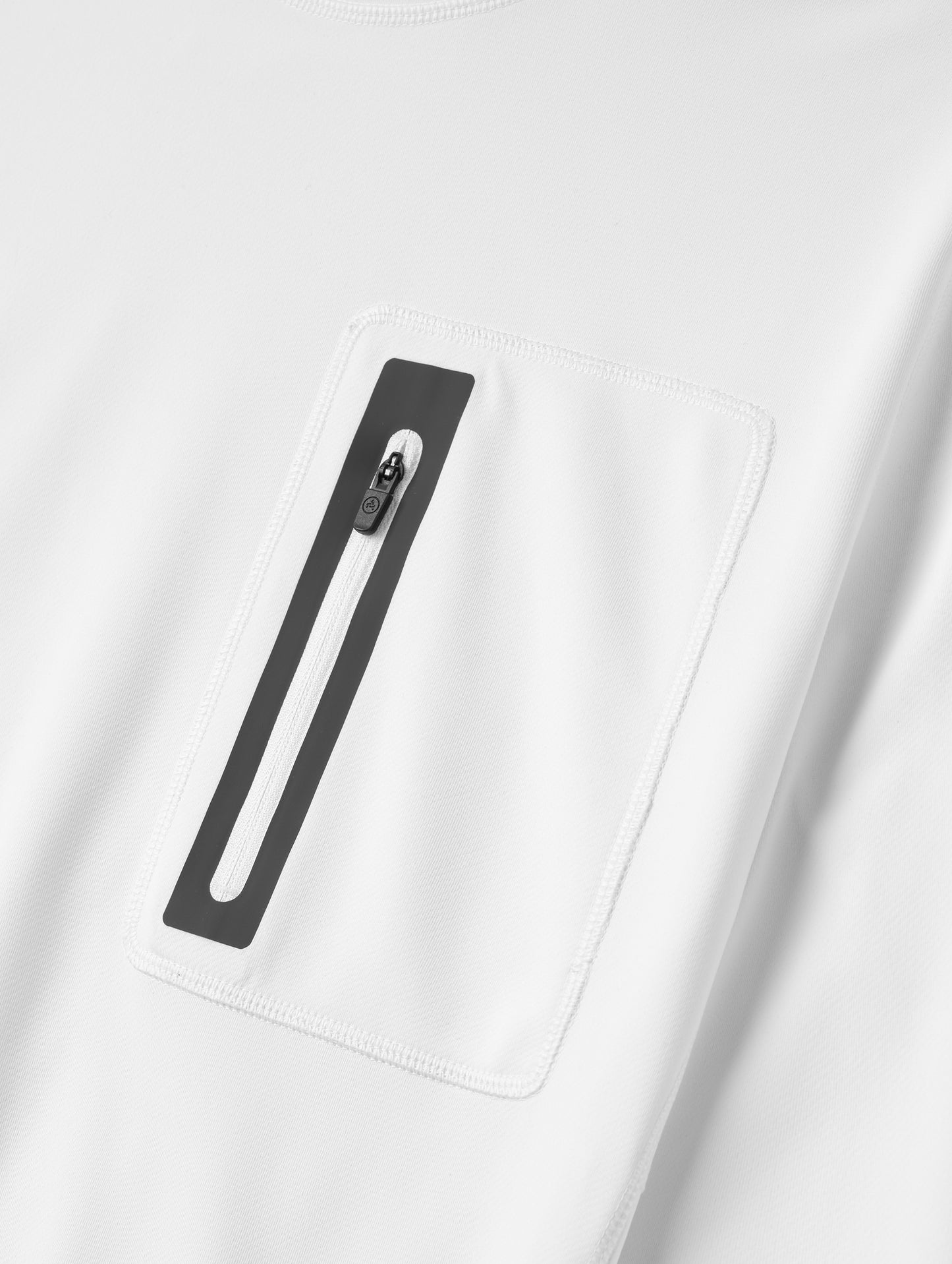 Closeup detailed view of the offset chest pocket on the Pacific Hooded Sun Shirt in White from AETHER Apparel.