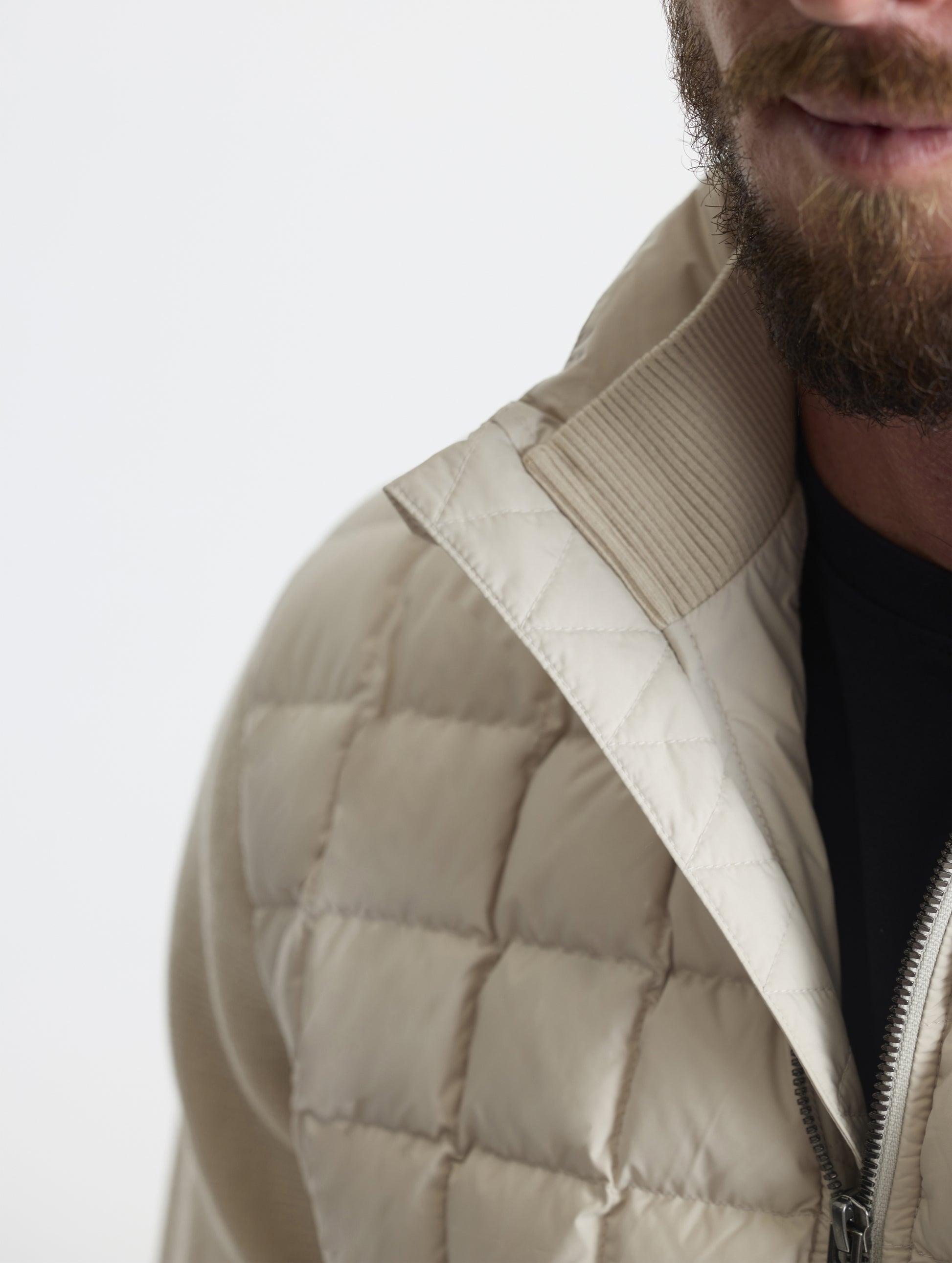 Closeup detailed view of the cotton-and-cashmere blend 2x2 rib knit interior collar on the M Phase Full-Zip in Bone white from AETHER Apparel.