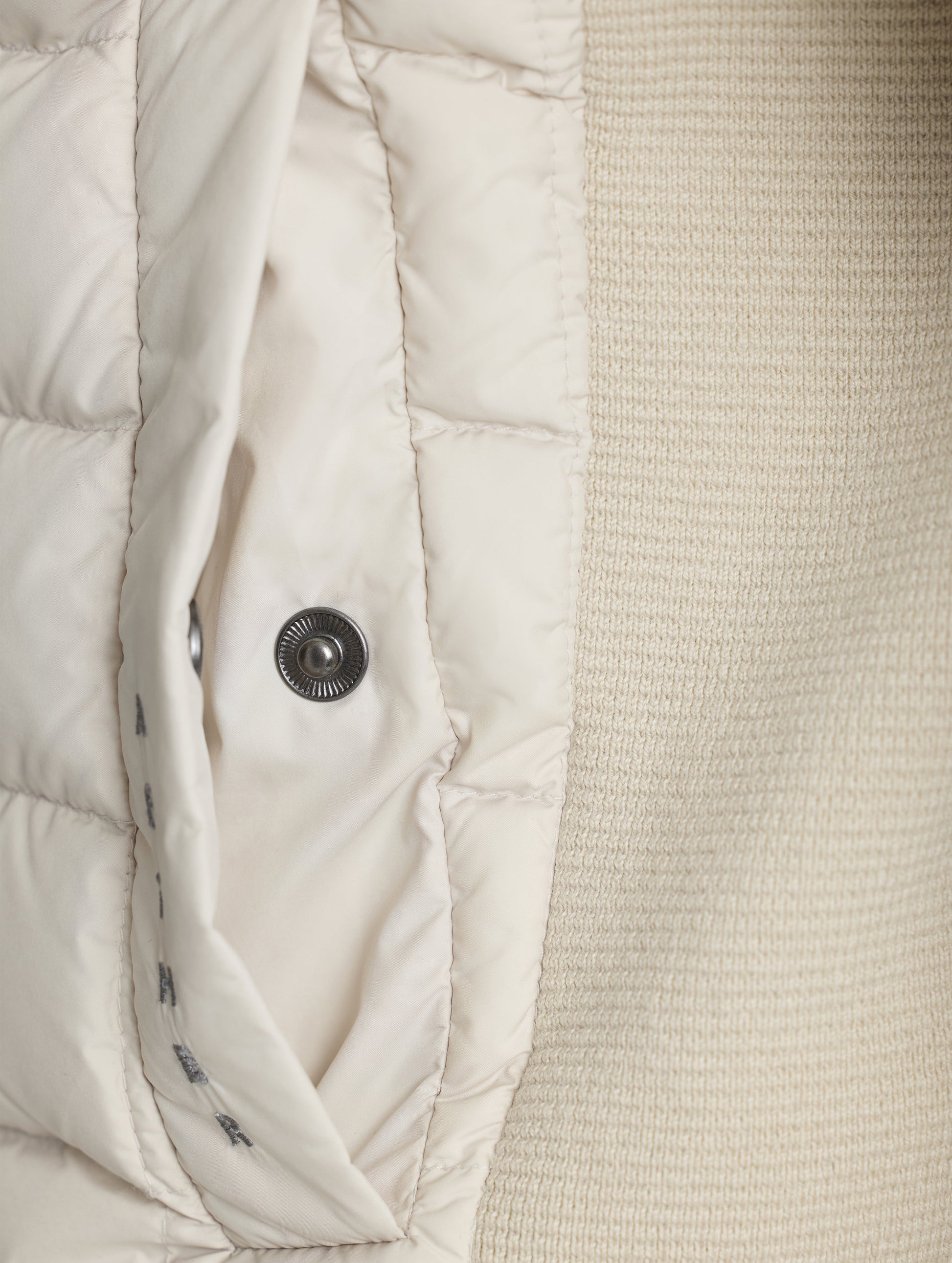 Closeup detailed view of the snap-secured welt hand pocket on the M Phase Full-Zip in Bone white from AETHER Apparel.