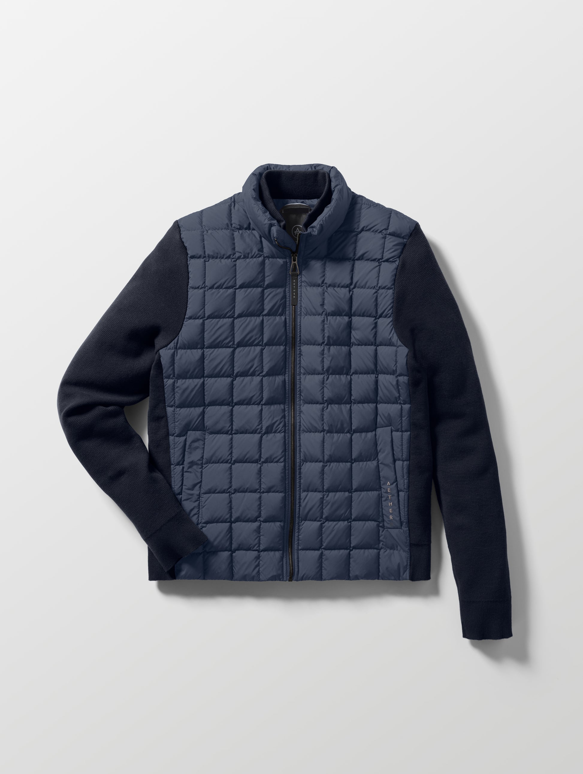 Flat lay of the M Phase Full-Zip in Total Eclipse dark blue from AETHER Apparel.