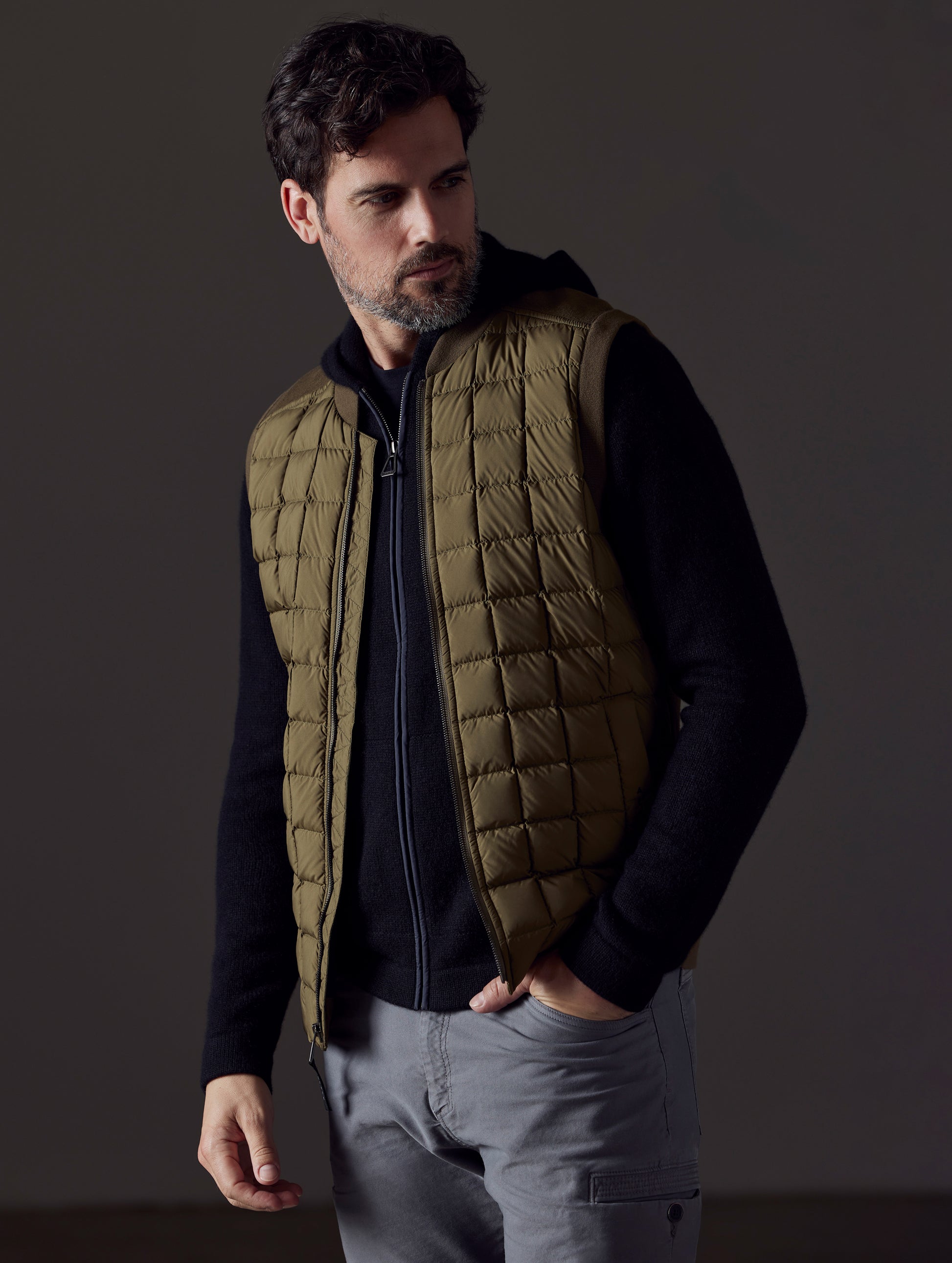 man wearing green insulated vest from AETHER Apparel