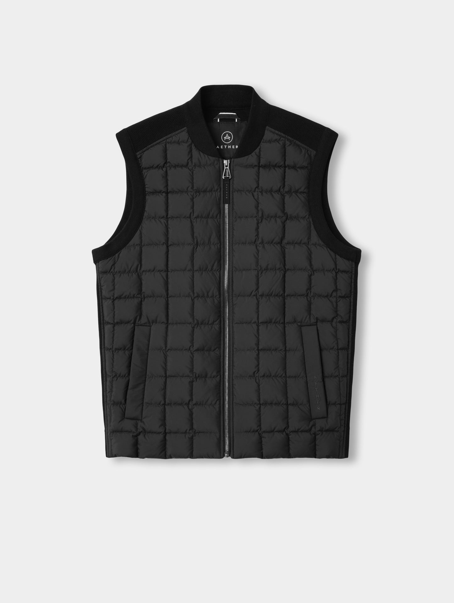 Flat lay view of the M Phase Vest in Onyx Black from AETHER Apparel. 