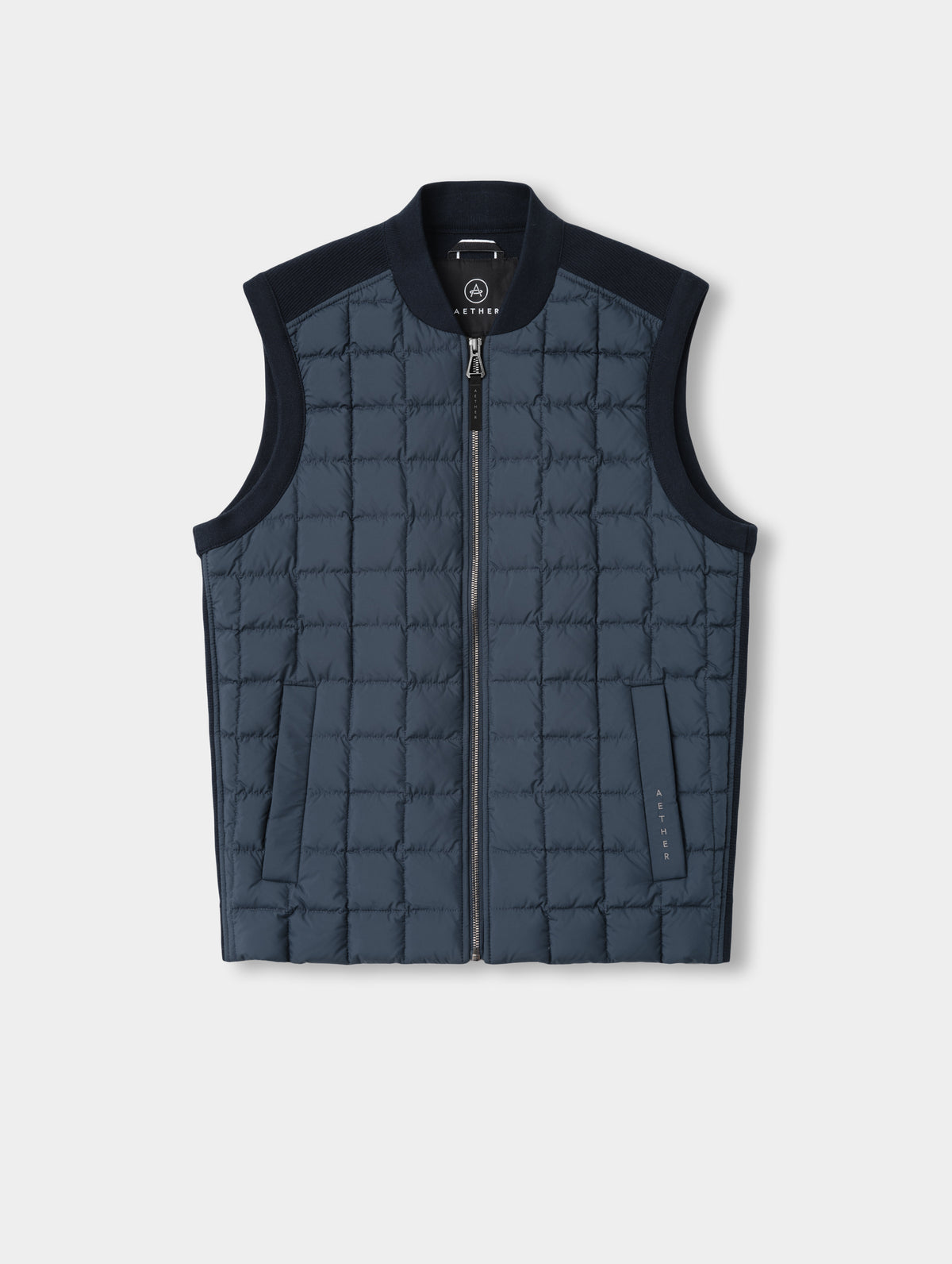 Flat lay view of the M Phase Vest in Total Eclipse from AETHER Apparel. 