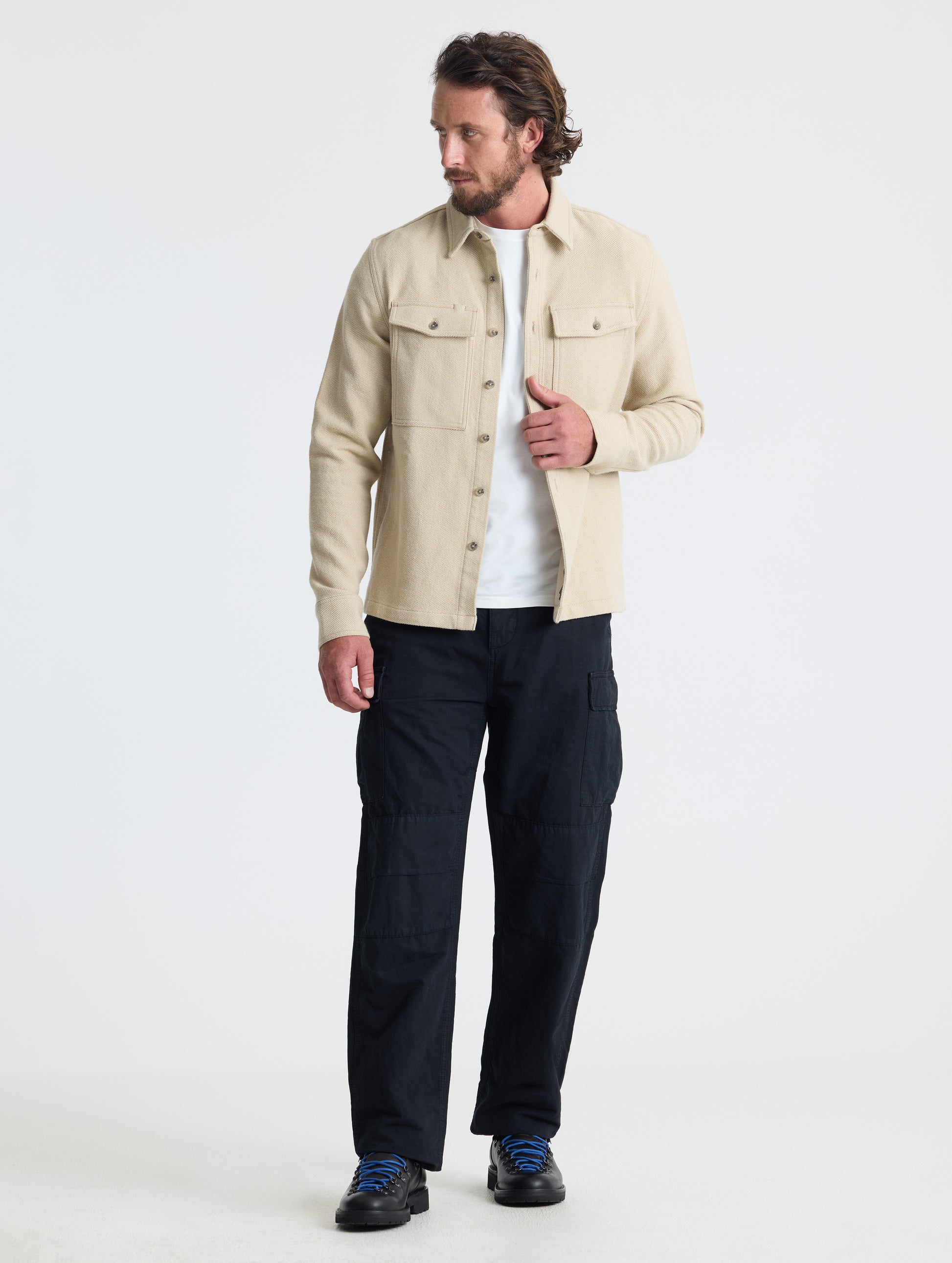 Front full-body view of man wearing Pioneer Heavyweight Button-Down in Bone white from AETHER Apparel.
