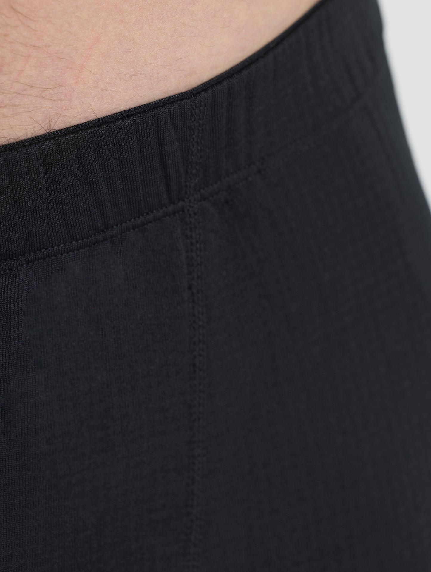 Closeup detailed view of the waistband on the Polar Base Layer Pant in Onyx Black from AETHER Apparel.