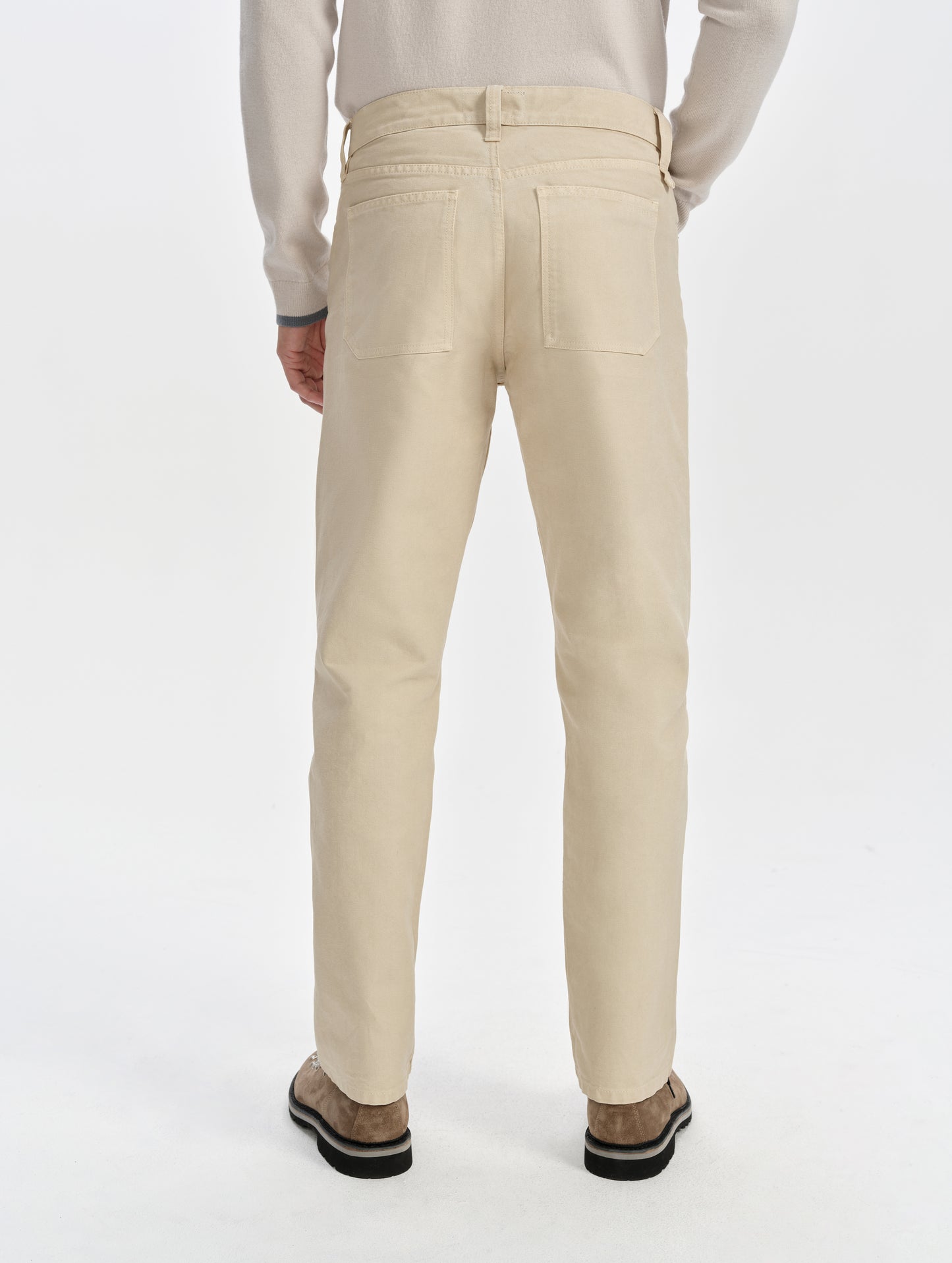 Rear lower-body view of man wearing the Porter 5-Pocket Pant in Bone from AETHER Apparel.