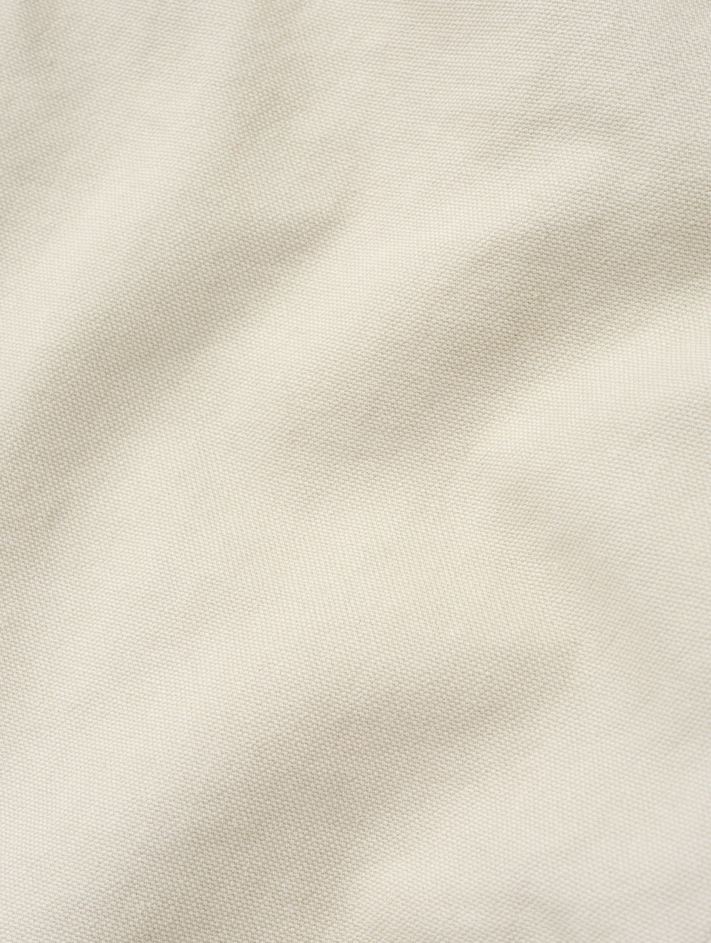 Closeup detailed view of the canvas construction on the Porter 5-Pocket Pant in Bone from AETHER Apparel.
