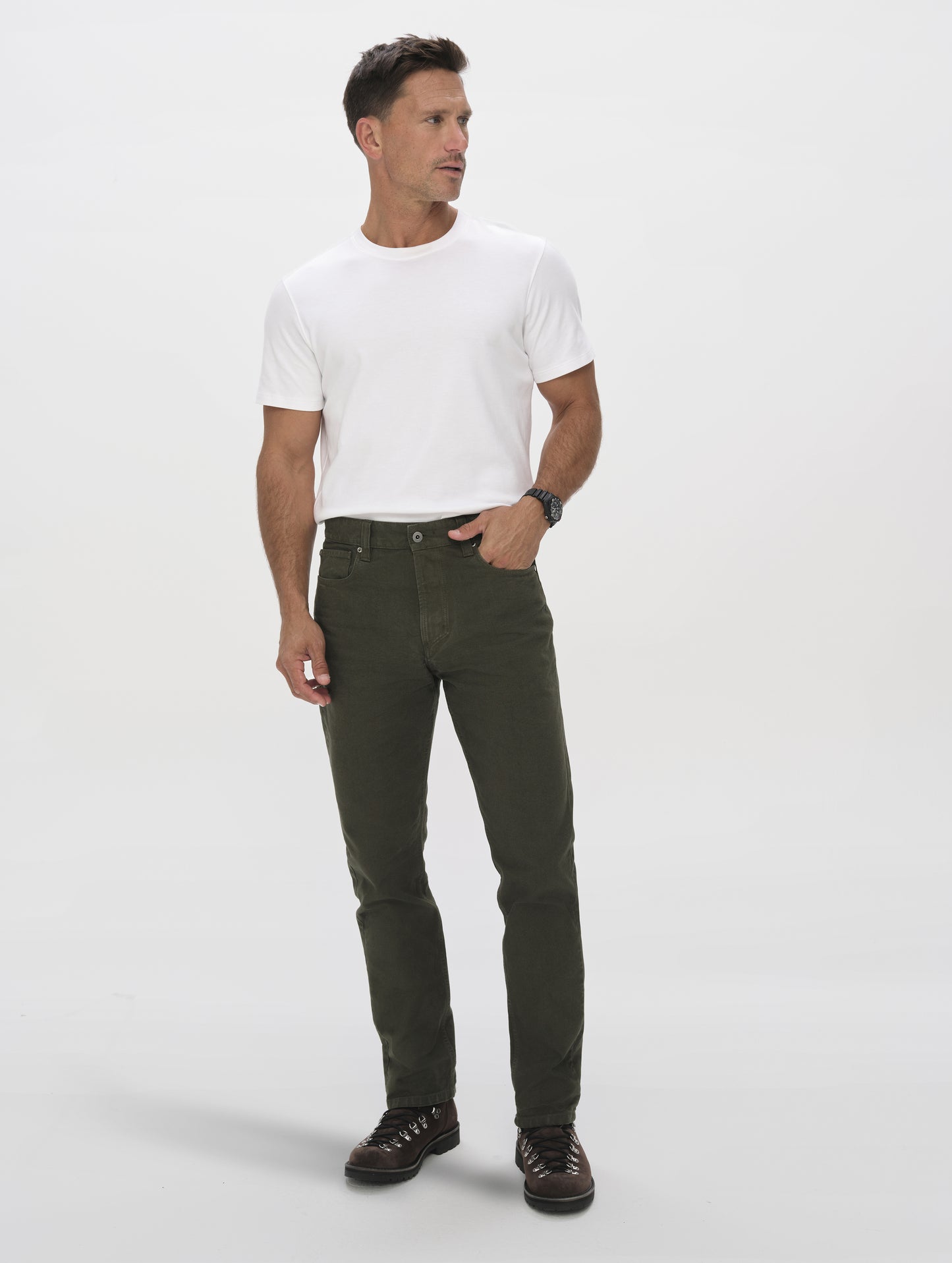 Front full-body view of man wearing the Porter 5-Pocket Pant in Forest Green from AETHER Apparel.