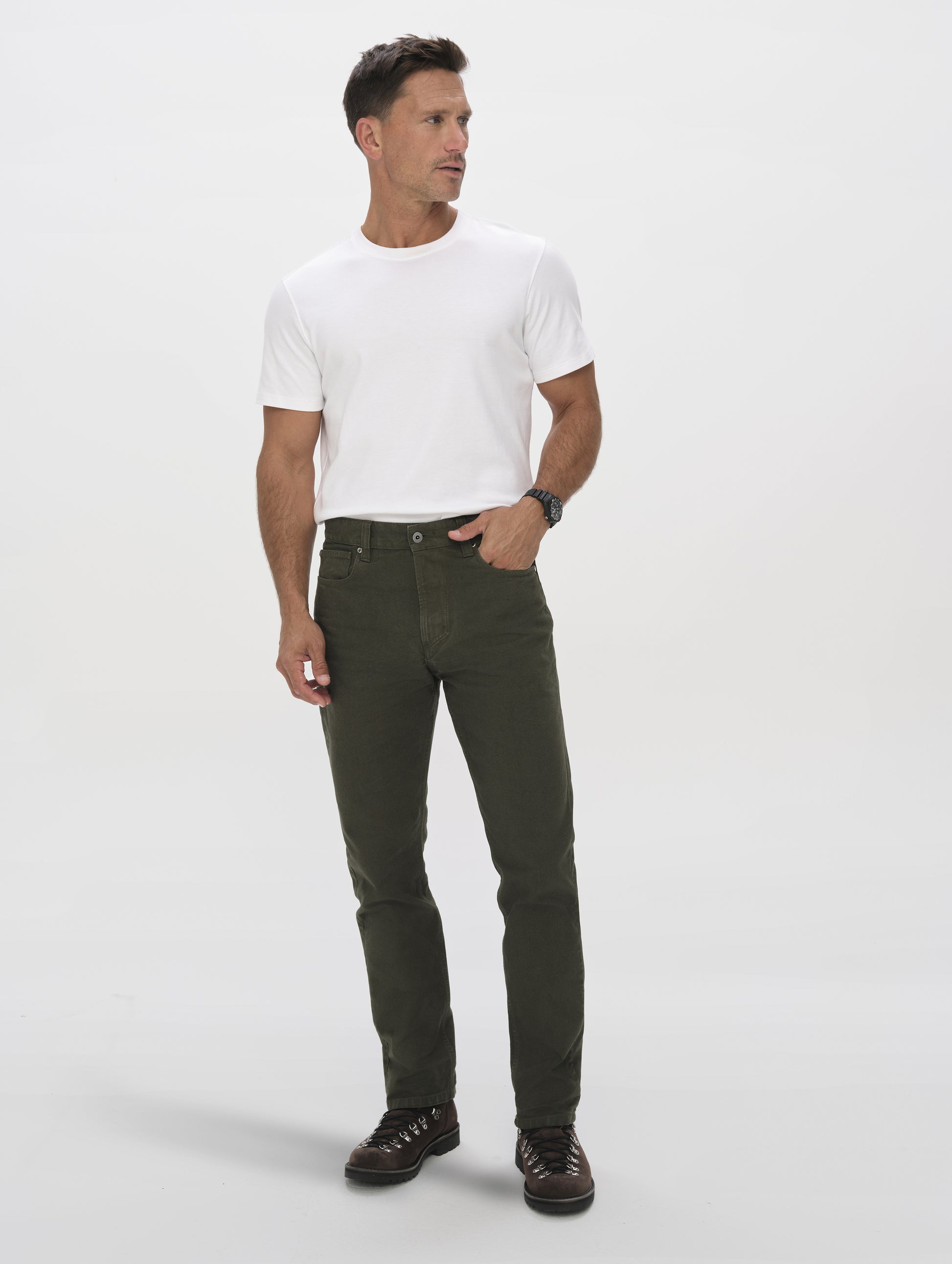 Front full-body view of man wearing the Porter 5-Pocket Pant in Forest Green from AETHER Apparel.