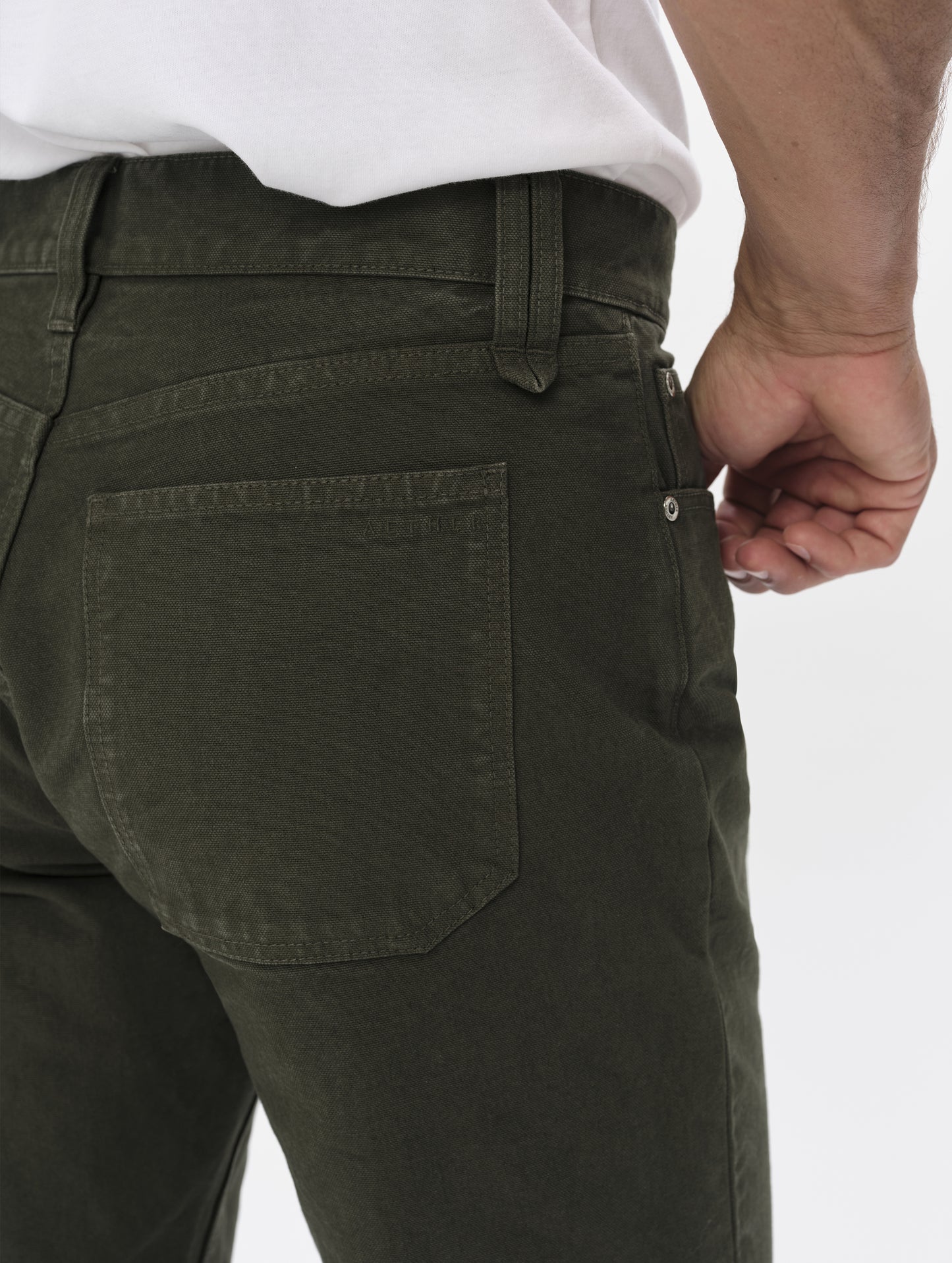 Closeup detailed view of the back pockets and main closure on the Porter 5-Pocket Pant in Forest Green from AETHER Apparel.