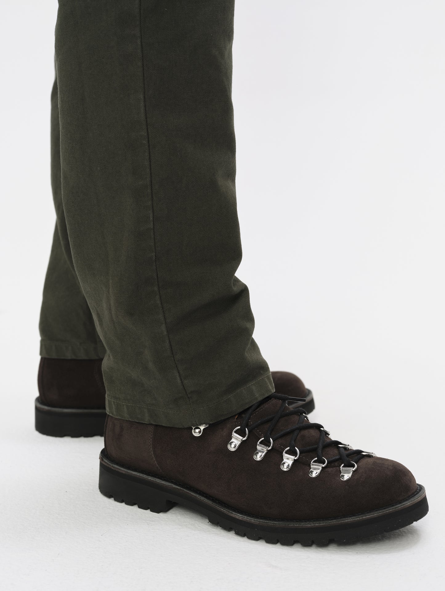 Closeup detailed view of the leg cuffs on the Porter 5-Pocket Pant in Forest Green from AETHER Apparel.