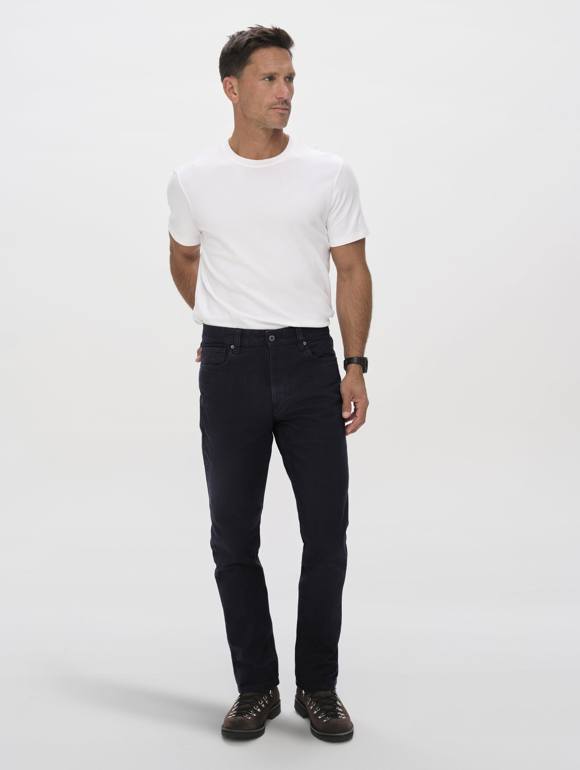 Front full-body view of man wearing the Porter 5-Pocket Pant in Onyx Black from AETHER Apparel.