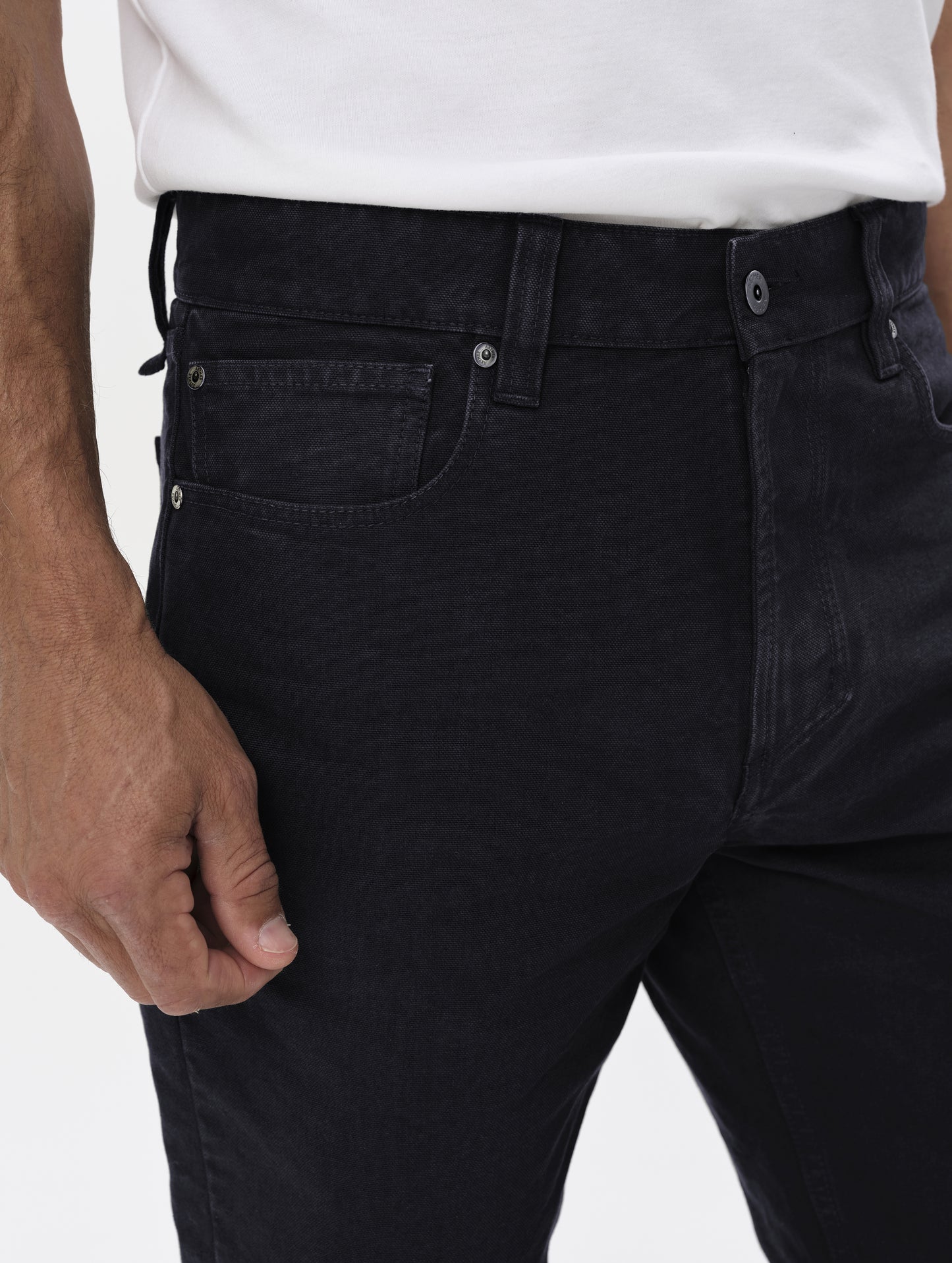 Closeup detailed view of the hand pockets and main closure on the Porter 5-Pocket Pant in Onyx Black from AETHER Apparel.