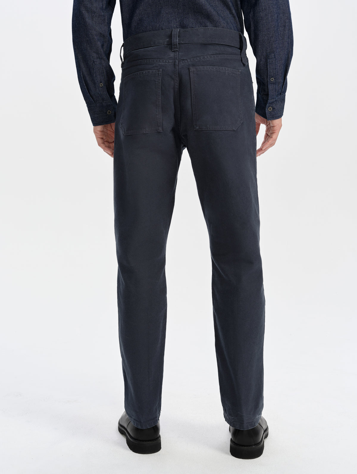 Rear lower-body view of man wearing the Porter 5-Pocket Pant in Graphite from AETHER Apparel.