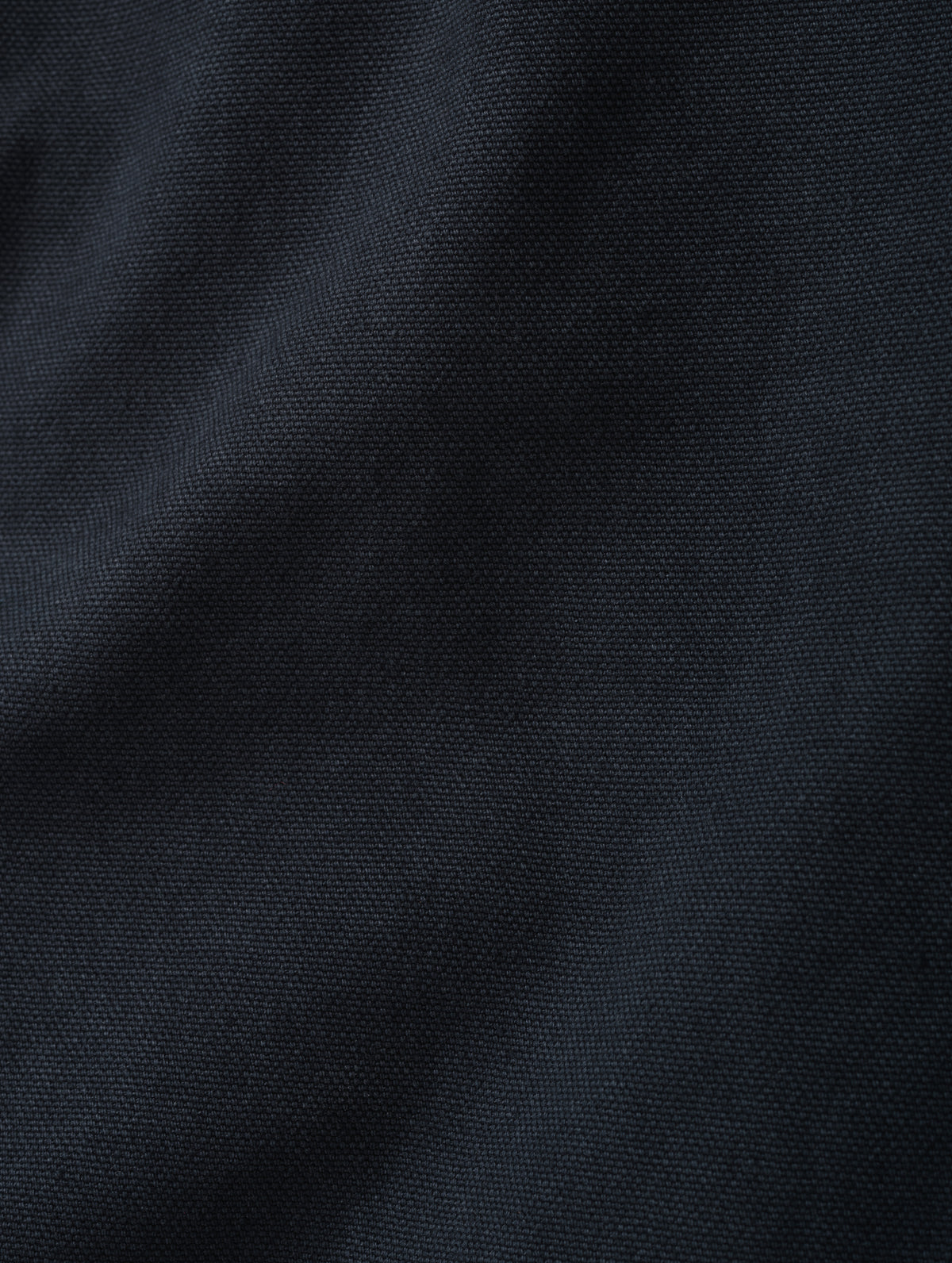 Closeup detailed view of the canvas construction on the Porter 5-Pocket Pant in Graphite from AETHER Apparel.