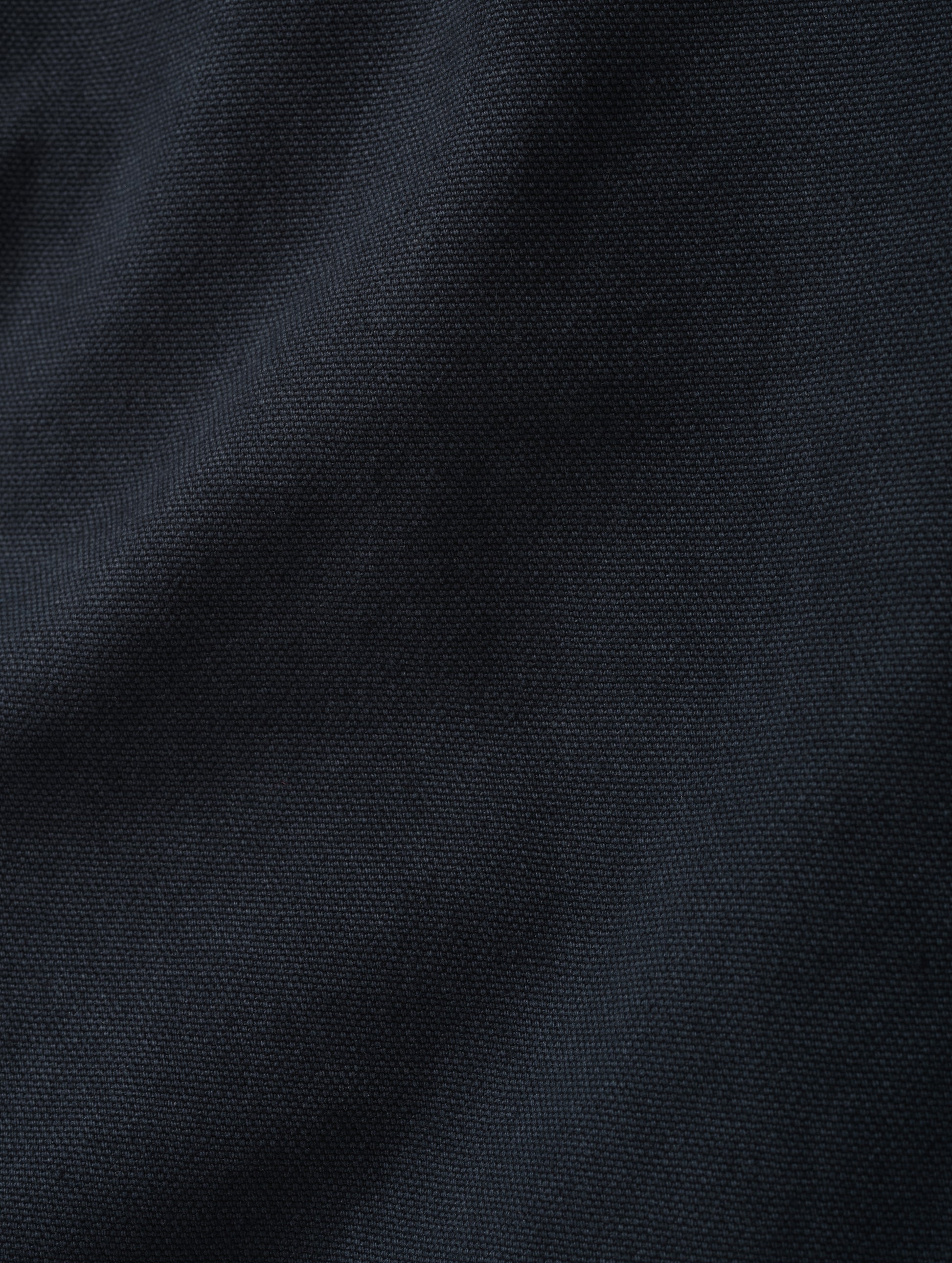 Closeup detailed view of the canvas construction on the Porter 5-Pocket Pant in Graphite from AETHER Apparel.