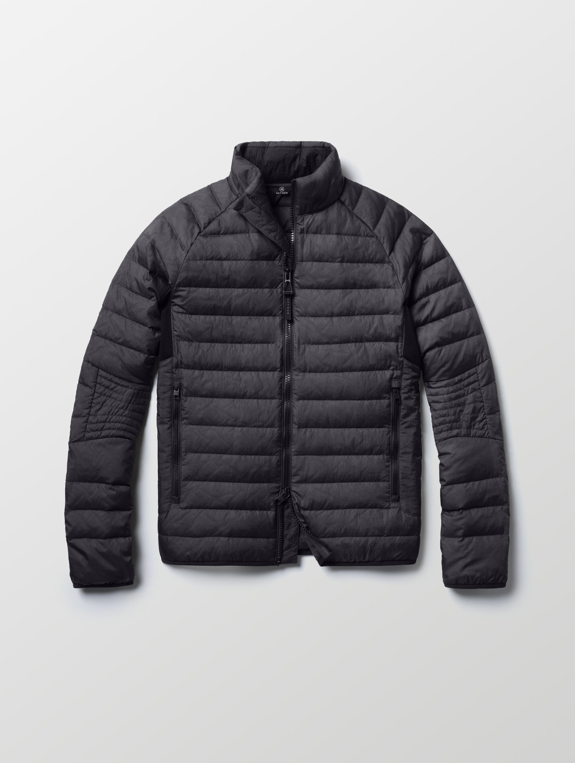 Flat lay of Prospect Packable Down Jacket in Onyx Black from AETHER Apparel.