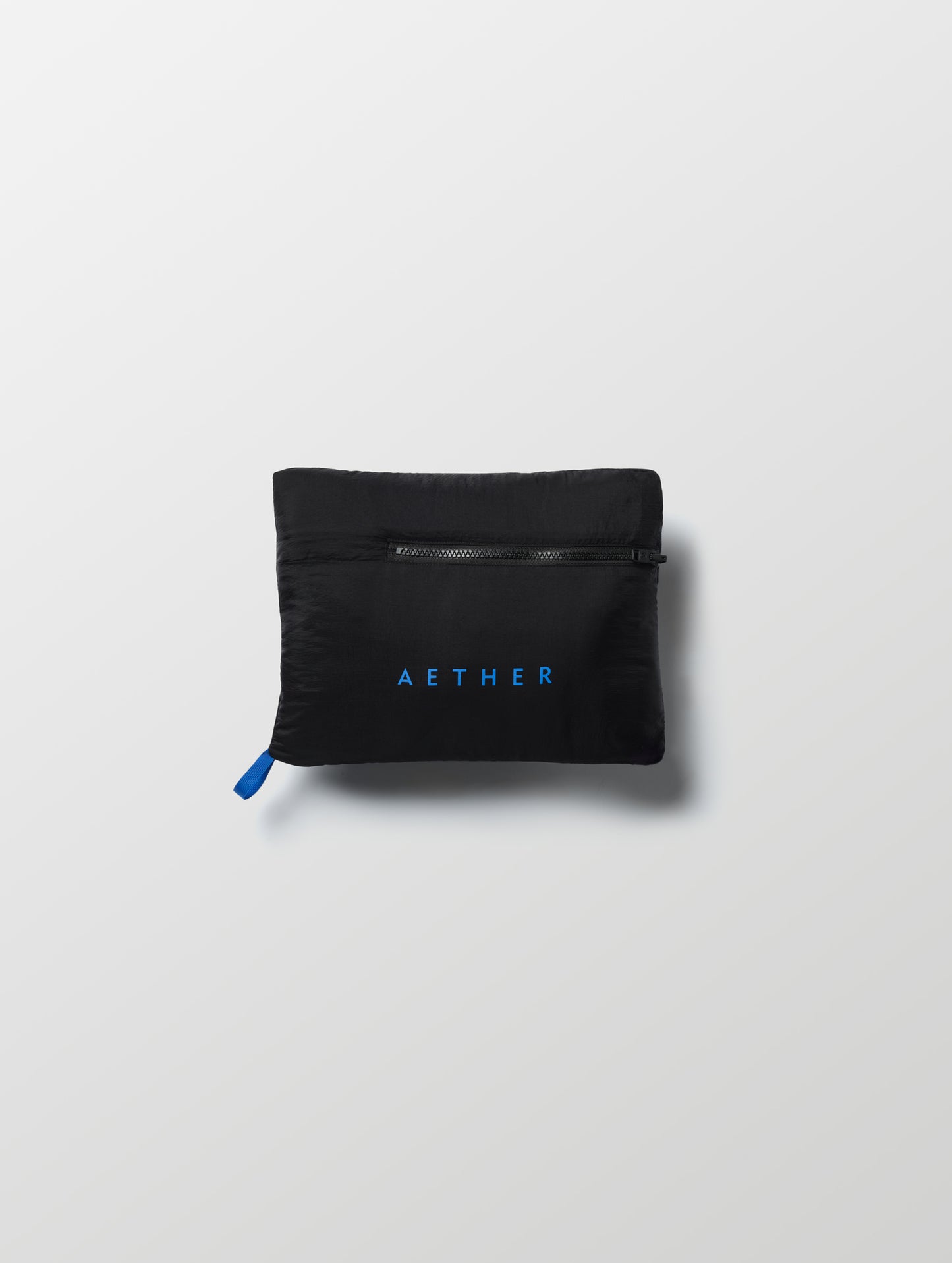 Self-packed Prospect Packable Down Jacket in Onyx Black from AETHER Apparel.