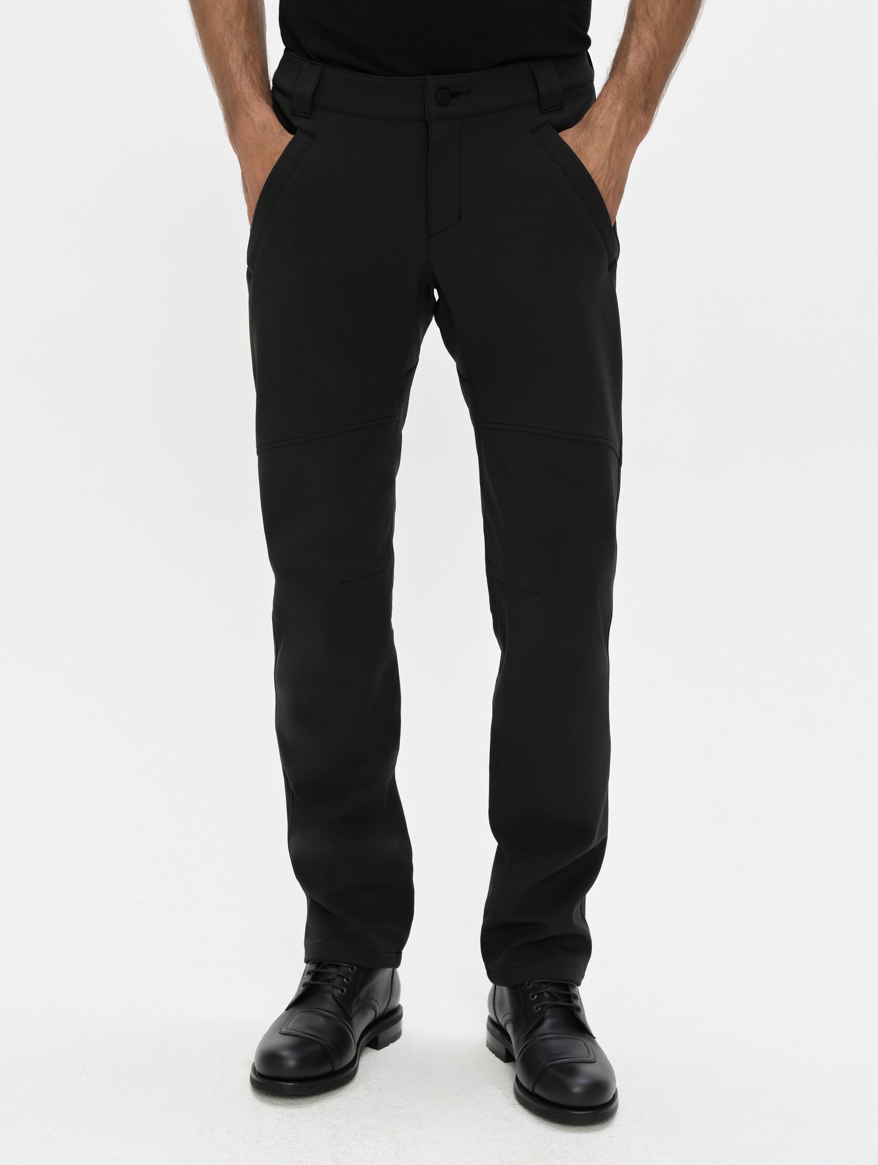 Front, lower-body view of man wearing the Ramble Motorcycle Pant 3.0 in Onyx Black from AETHER Apparel.
