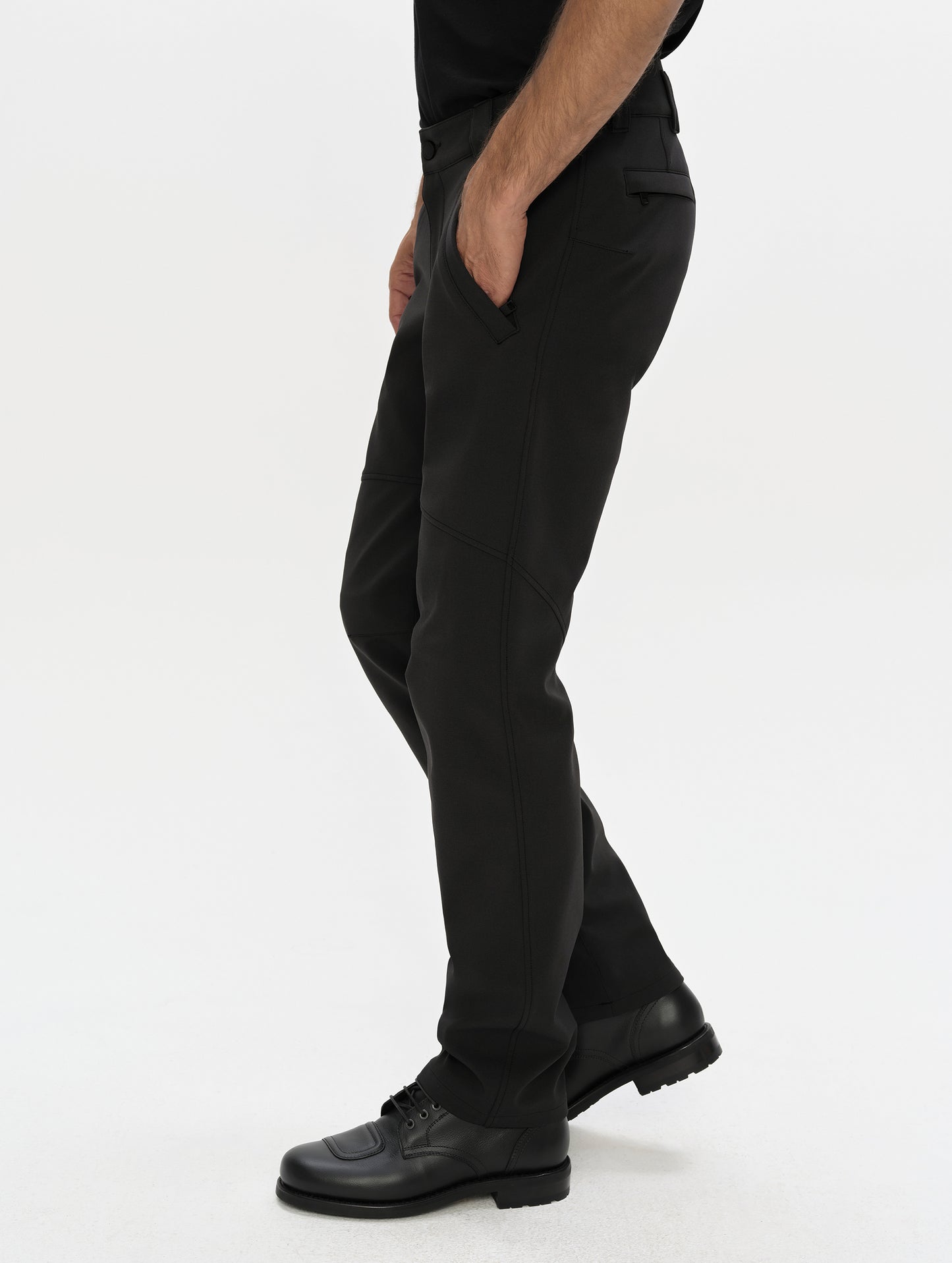 Side, profile, lower-body view of man wearing the Ramble Motorcycle Pant 3.0 in Onyx Black from AETHER Apparel.