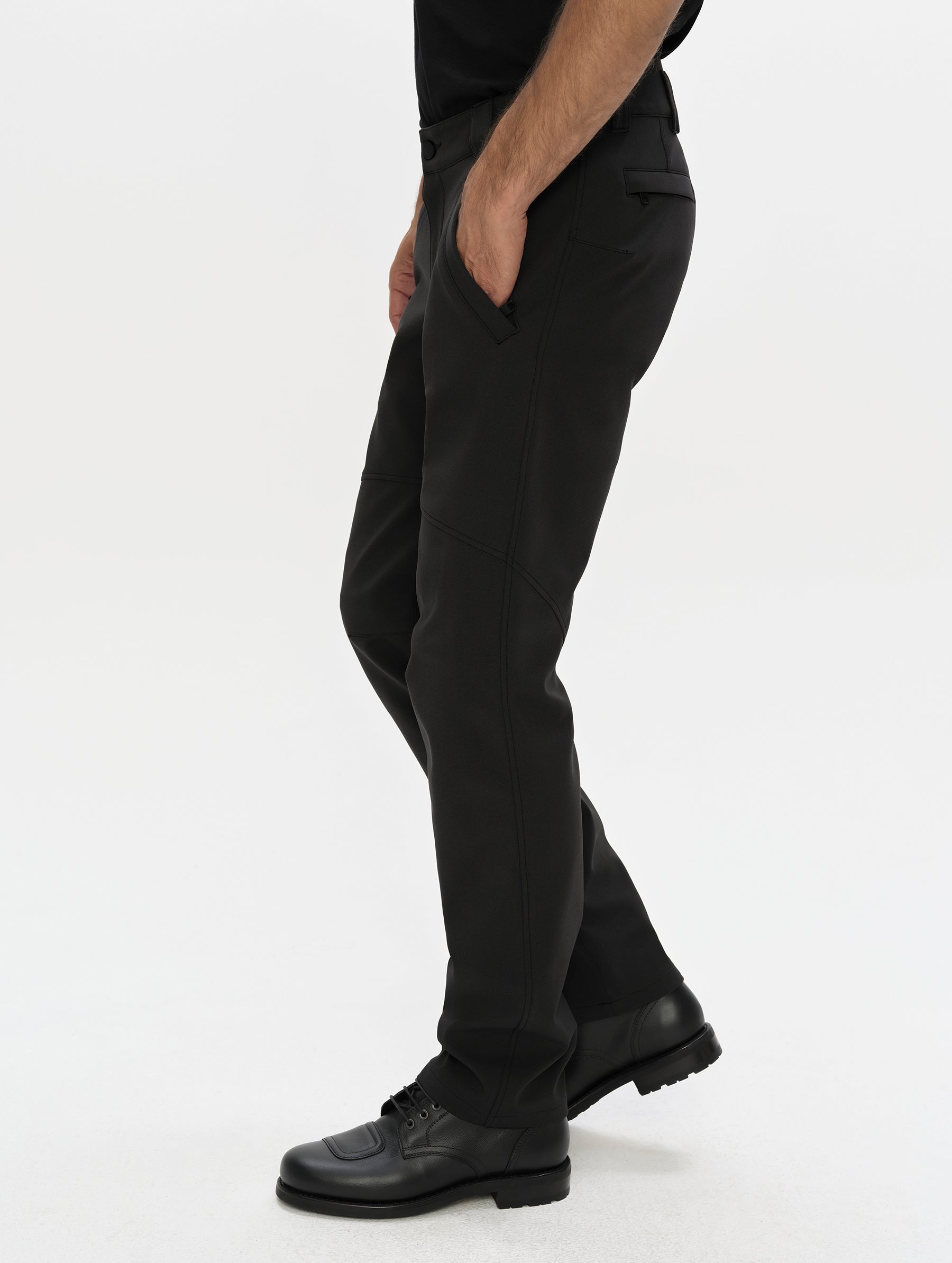 Side, profile, lower-body view of man wearing the Ramble Motorcycle Pant 3.0 in Onyx Black from AETHER Apparel.