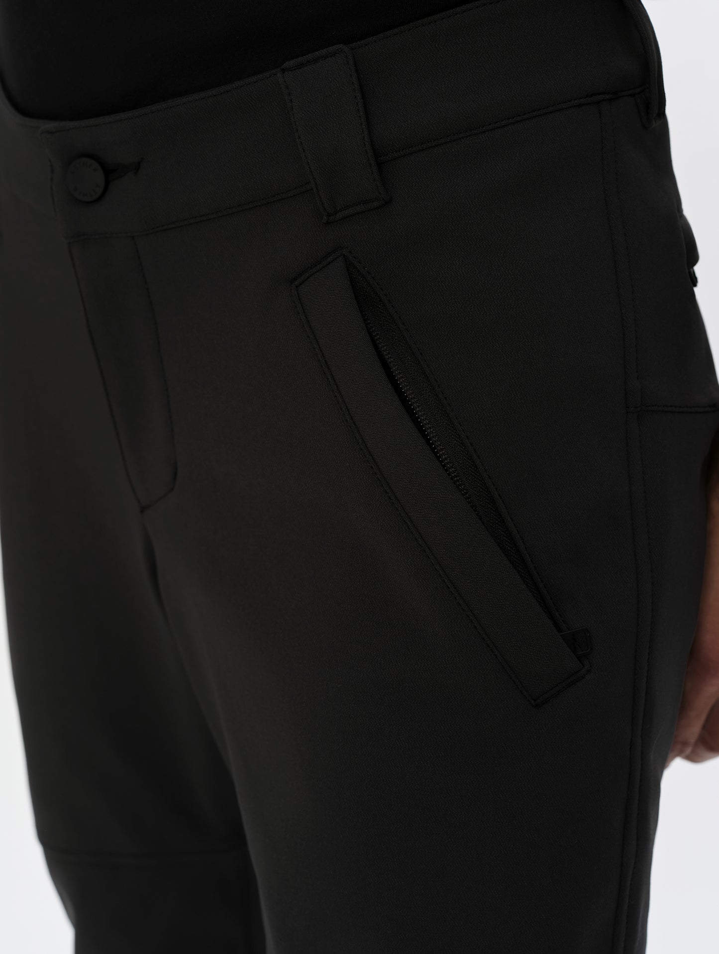 Closeup detailed view of the zipper-secured hand pockets on the Ramble Motorcycle Pant 3.0 in Onyx Black from AETHER Apparel.