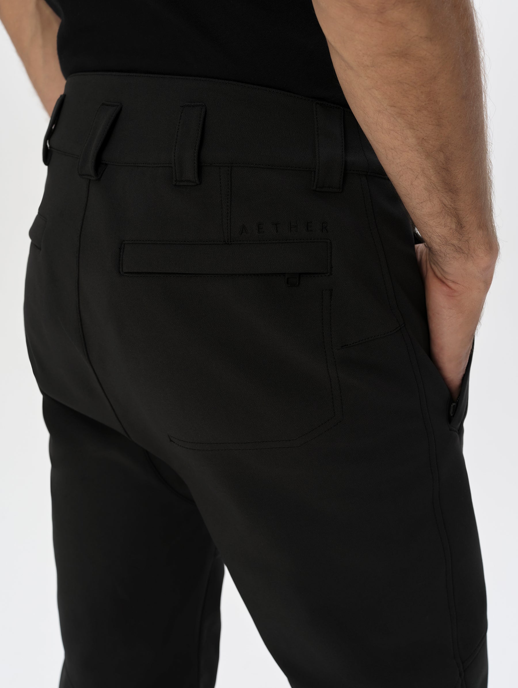 Semi closeup view of the back pockets and rear belt loops on the Front, lower-body view of man wearing the Ramble Motorcycle Pant 3.0 in Onyx Black from AETHER Apparel.