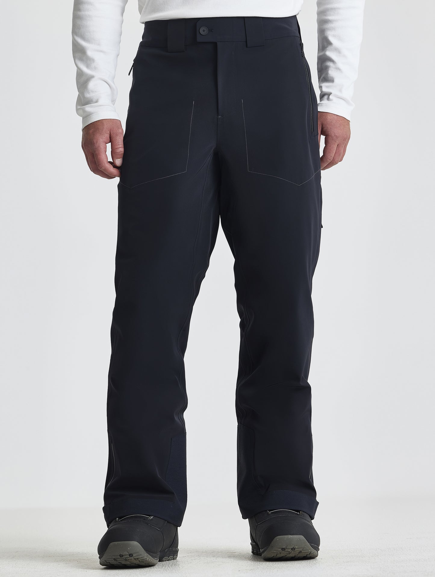 Front lower-body view of man wearing the Ridge Insulated Snow Pant in Onyx Black from AETHER Apparel.