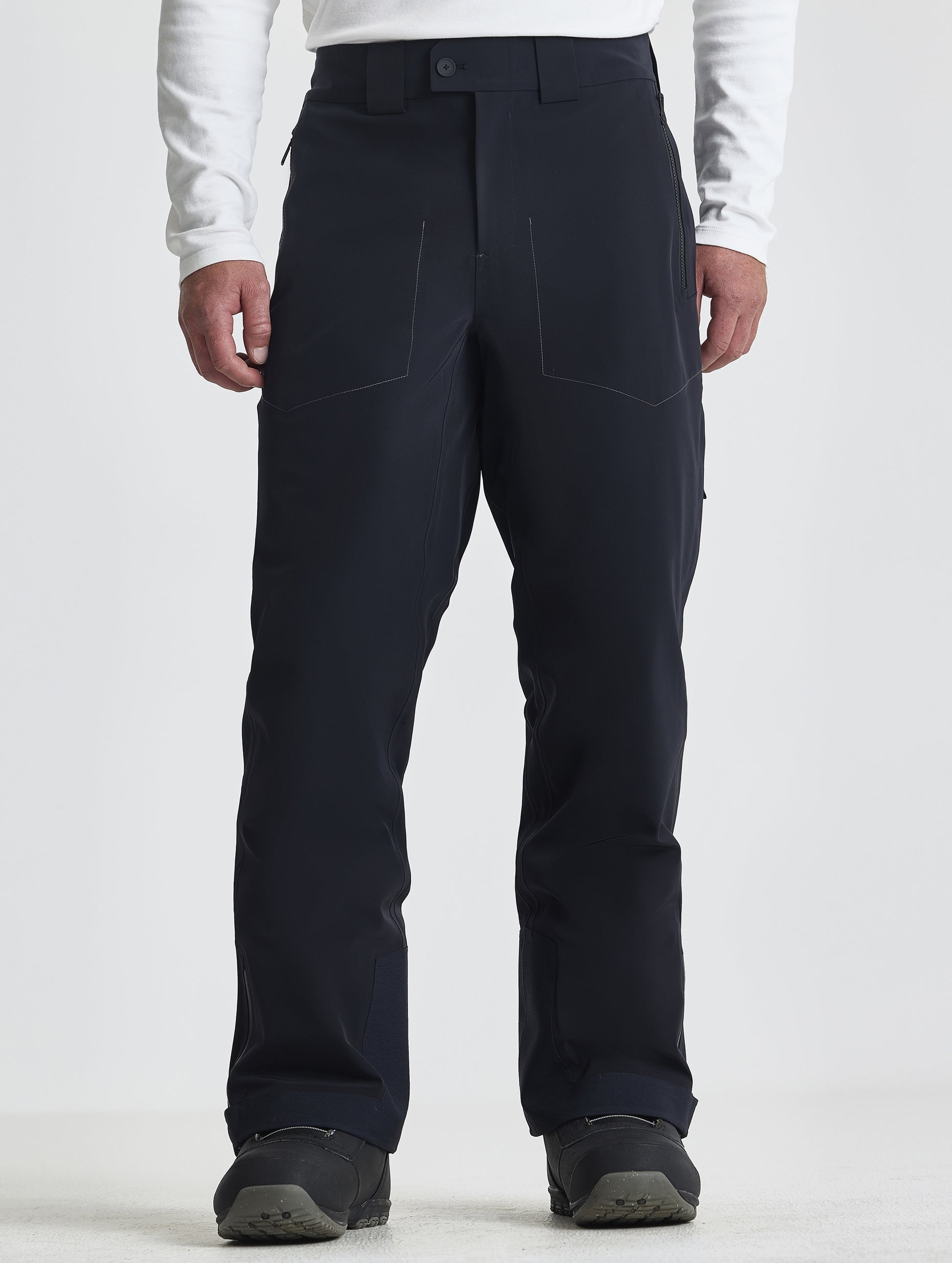 Front lower-body view of man wearing the Ridge Insulated Snow Pant in Onyx Black from AETHER Apparel.