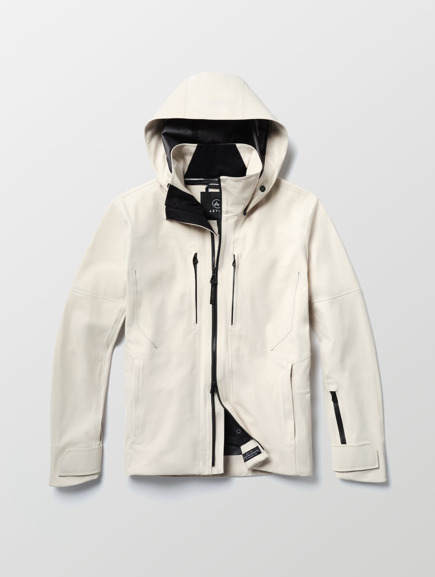 Flat lay of the Ridge Snow-Shell Jacket in Bone from AETHER Apparel.