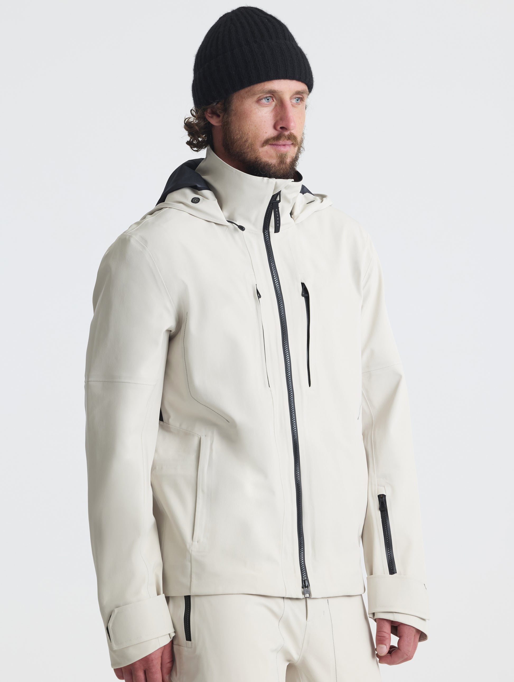 Front angled upper-body view of man wearing the Ridge Snow-Shell Jacket in Bone from AETHER Apparel.