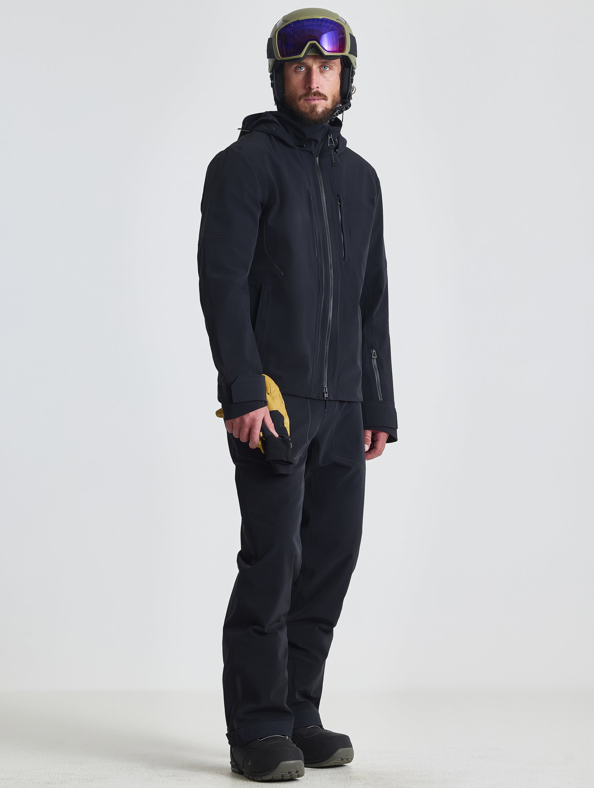 Front angled full-body view of man wearing the Ridge Snow-Shell Jacket in Onyx Black from AETHER Apparel.