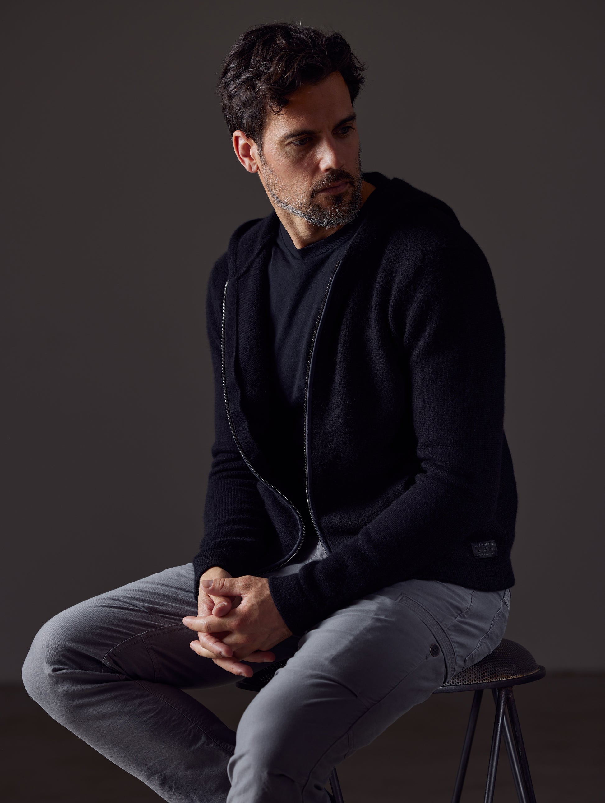 Man wearing black Sawyer Cashmere Full-Zip from AETHER Apparel