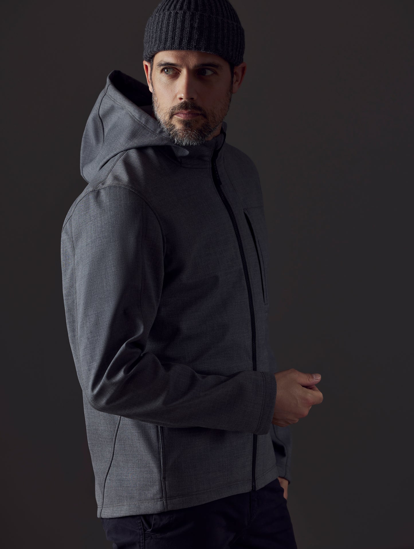 Man wearing grey technical jacket from AETHER Apparel